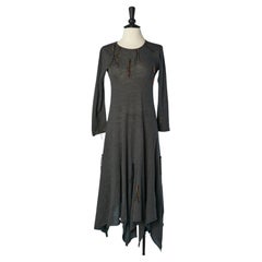 Grey asymmetrical wool jersey dress with embellishment Comme des Garçons 