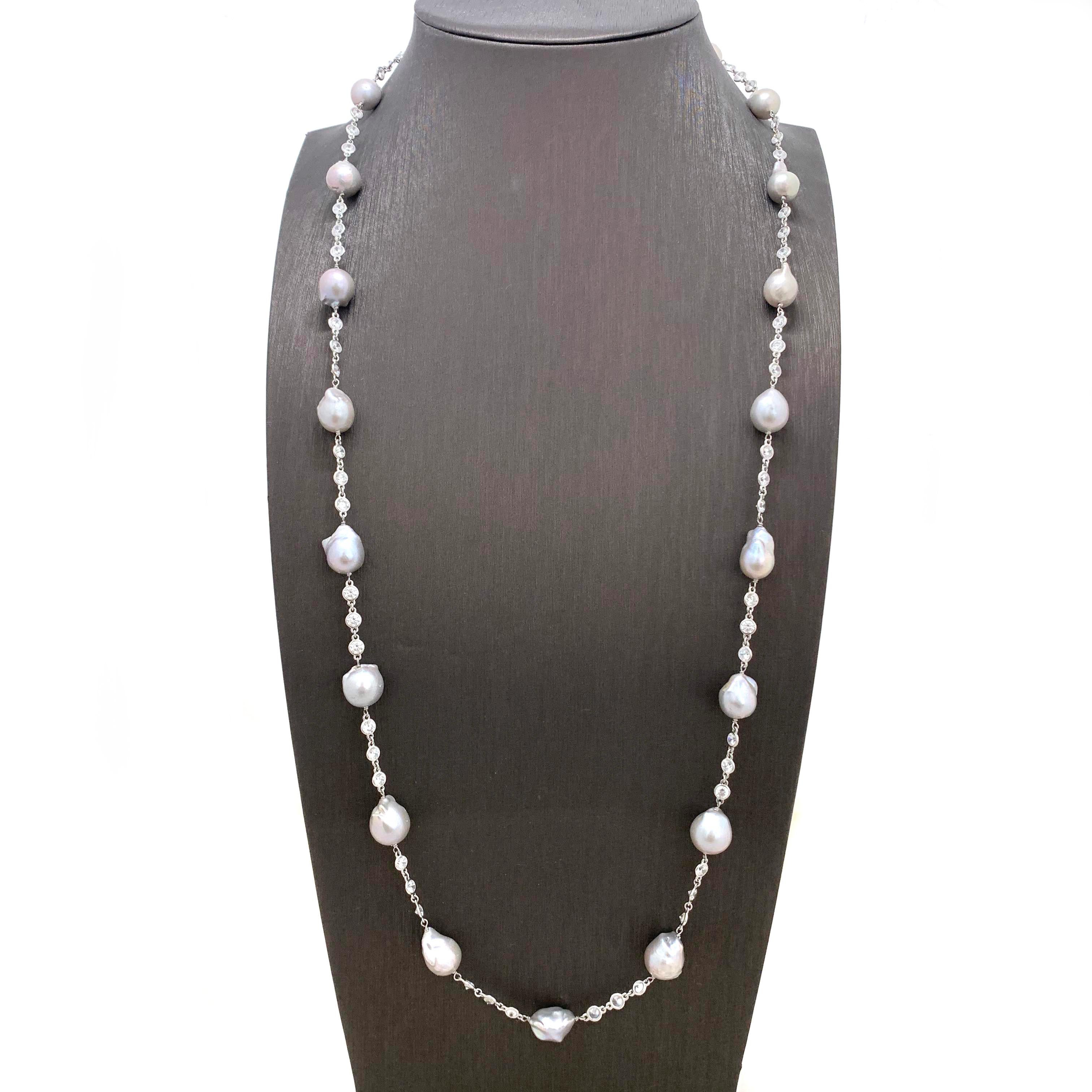 Grey Baroque Pearl Sterling Silver Long Station Necklace

The beautiful elegant necklace features 19 pieces of lustrous grey baroque pearl and continuous of hand bezel-set faceted simulated diamond cz (0.24ct size each - 16ct size total), all hand