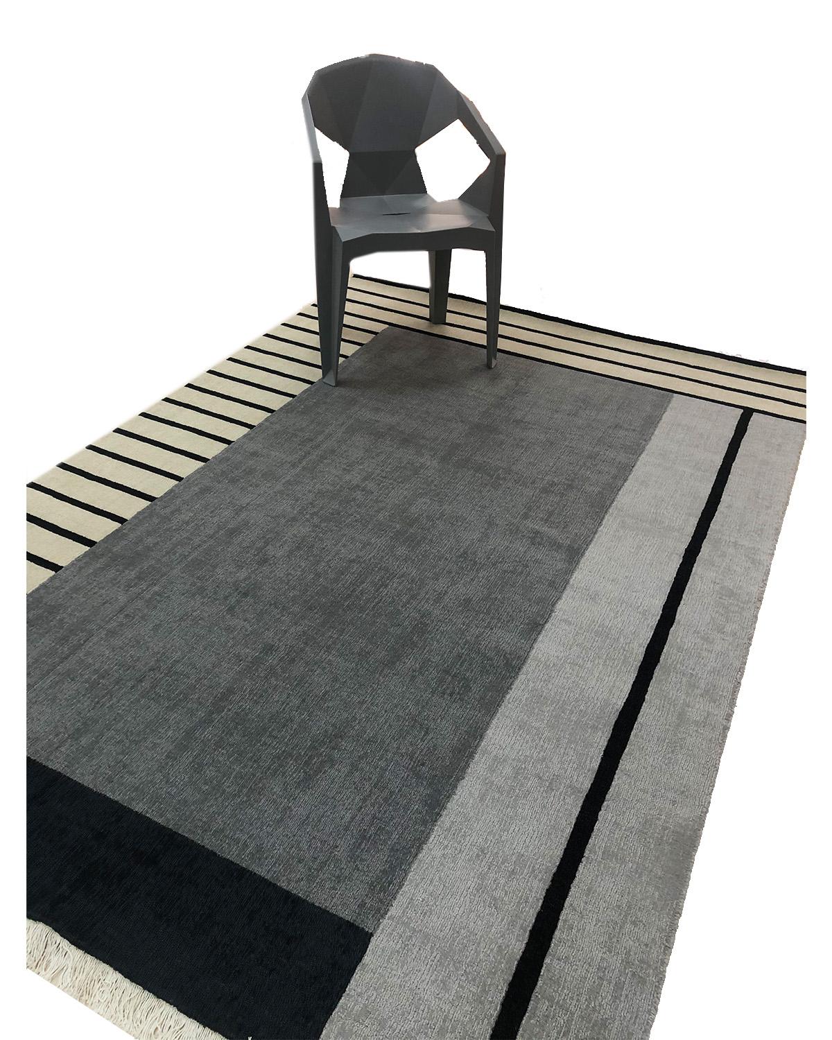 cream and black geometric rug