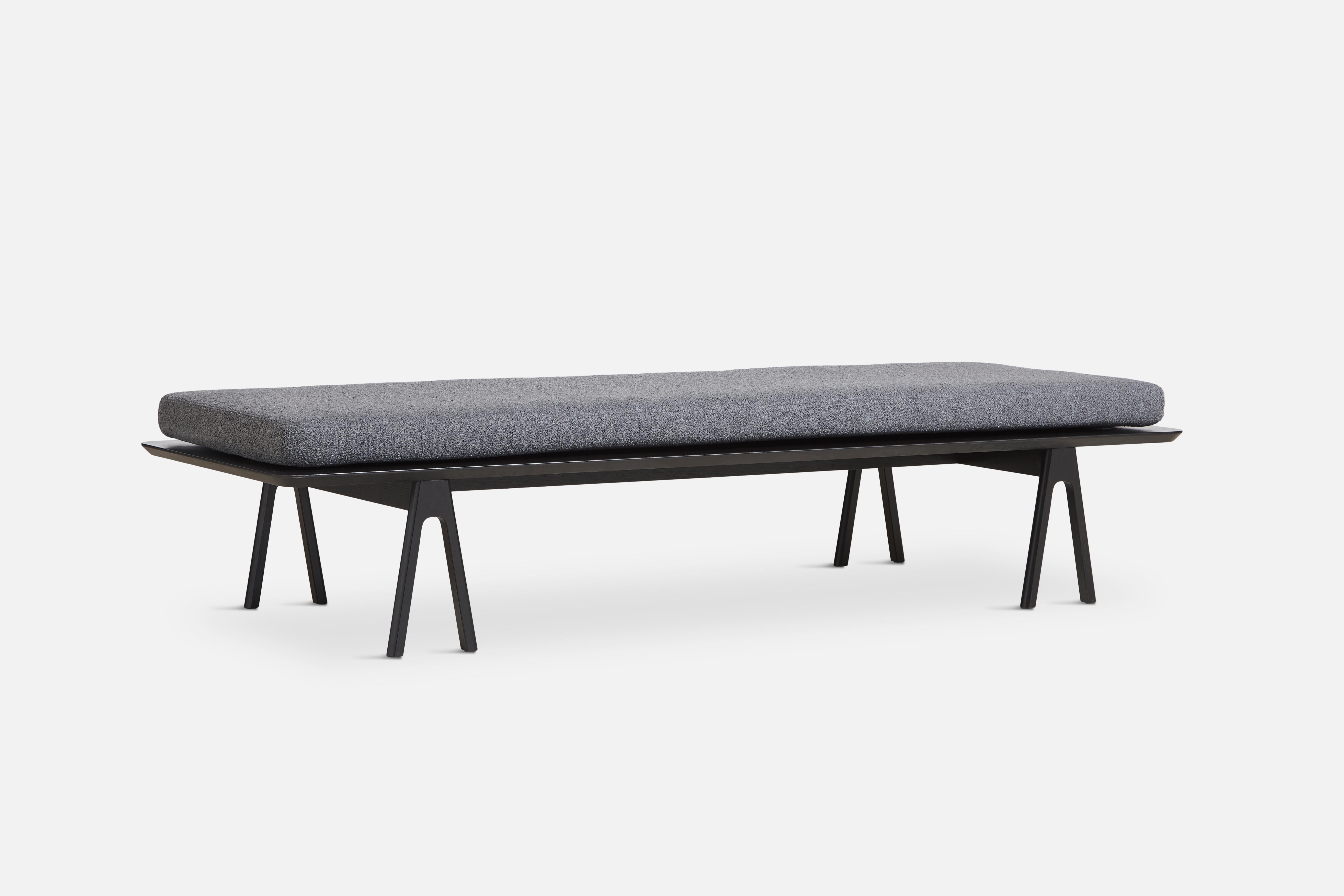 Grey black boucle level daybed by Msds Studio
Materials: Foam, oak, boucle.
Dimensions: D 76.5 x W 190 x H 41 cm

The founders, Mia and Torben Koed, decided to put their 30 years of experience into a new project. It was time for a change and a new