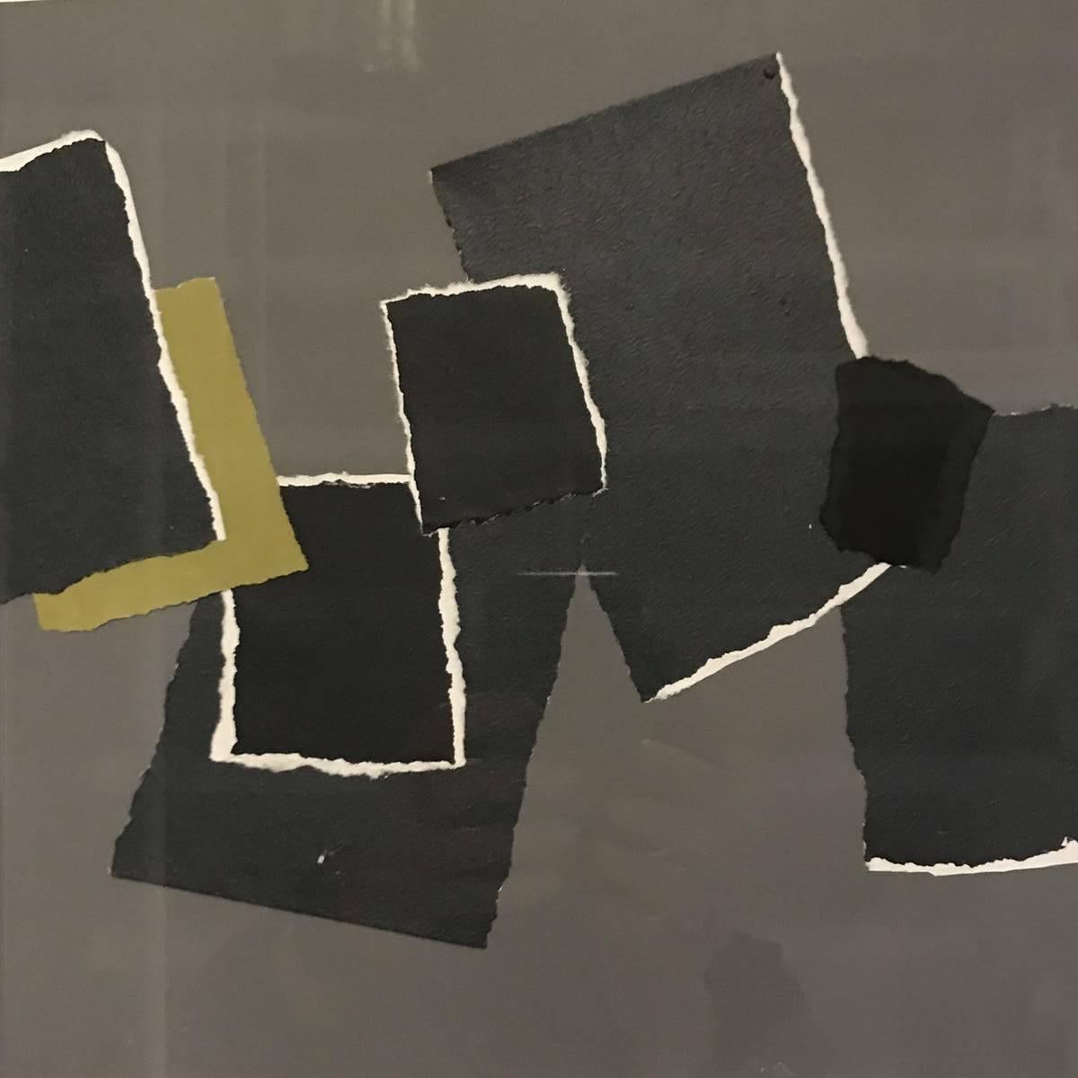 Abstract paper collage by contemporary French artist Isabelle Bouteillet.
Grey ground with black, darker grey rectangular paper shapes in an abstract design.
A small shape of chartreuse for pop.
Newly framed in white wood.


   