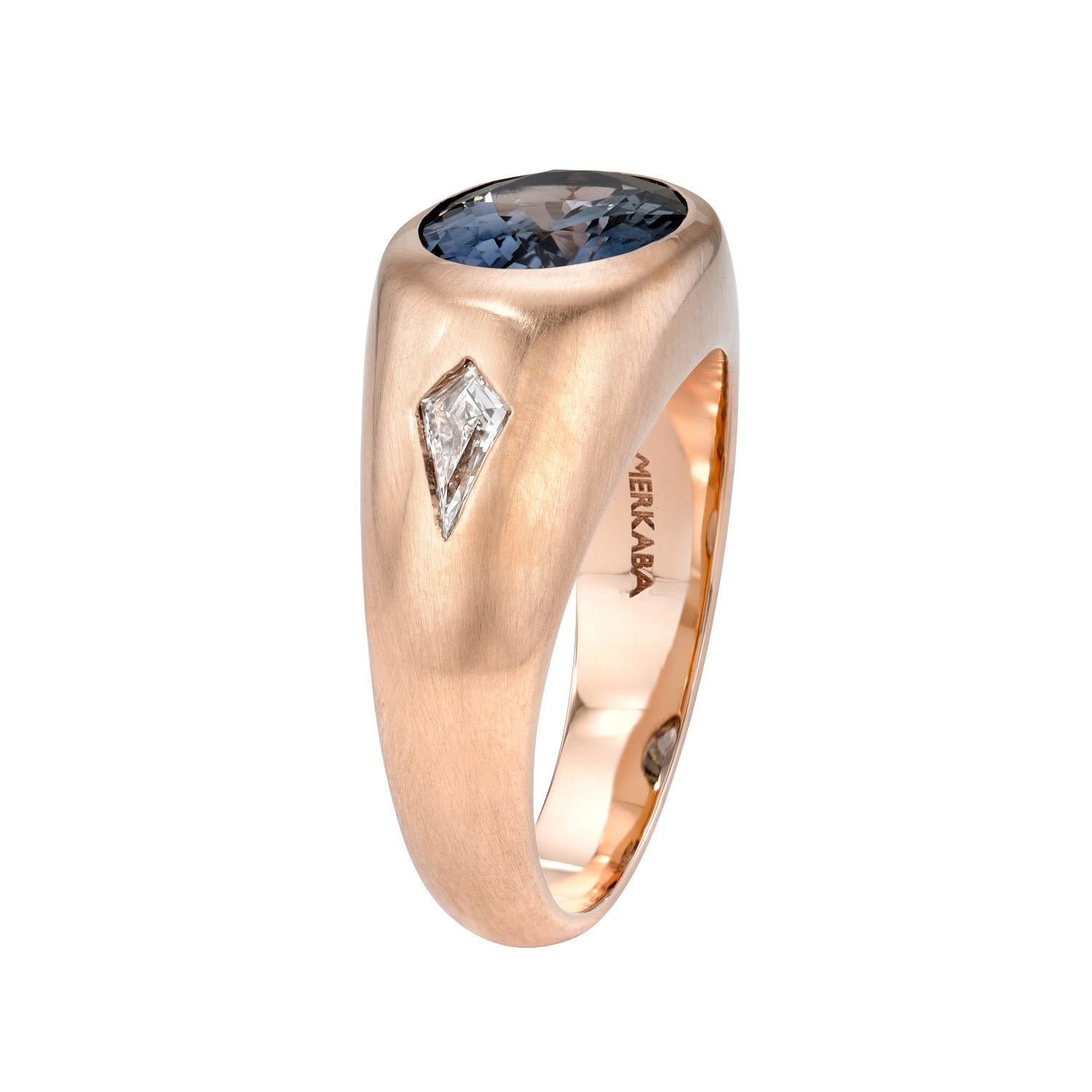 18K rose gold unisex ring set with a rare and remarkable 5.20 carat Grey-Blue oval Spinel, and a pair of E/VS1 Kite diamonds weighing a total of 0.32 carats. Matte brushed finish.
Ring size 10.5. Resizing is complementary upon request.
Crafted by