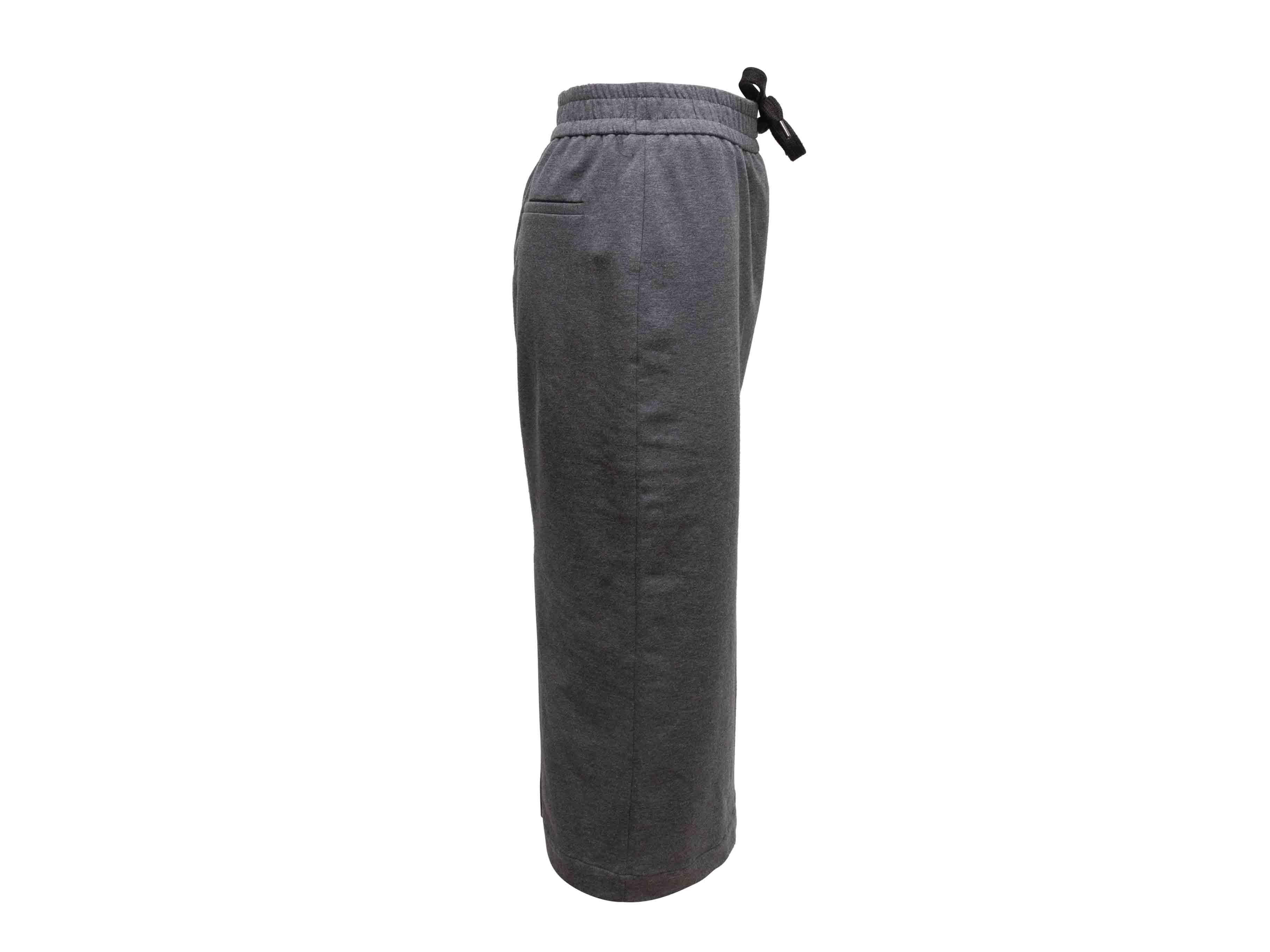 Grey cotton midi skirt by Brunello Cucinelli. Dual back pockets. Elasticized waistband featuring drawstring. 29