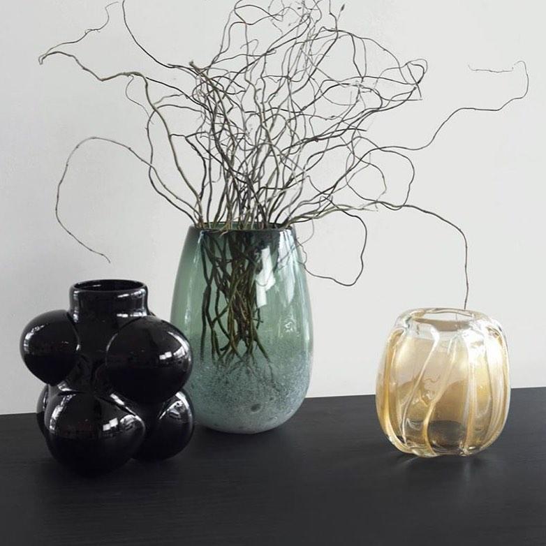 Grey bubble barrel vase
Measures: 9” T x 6” W

These works continue the language of contrast of the lattimo and banded lines but use a swath of textured whipped glass. This is then paired with a selection of soft colors and simple forms to create a