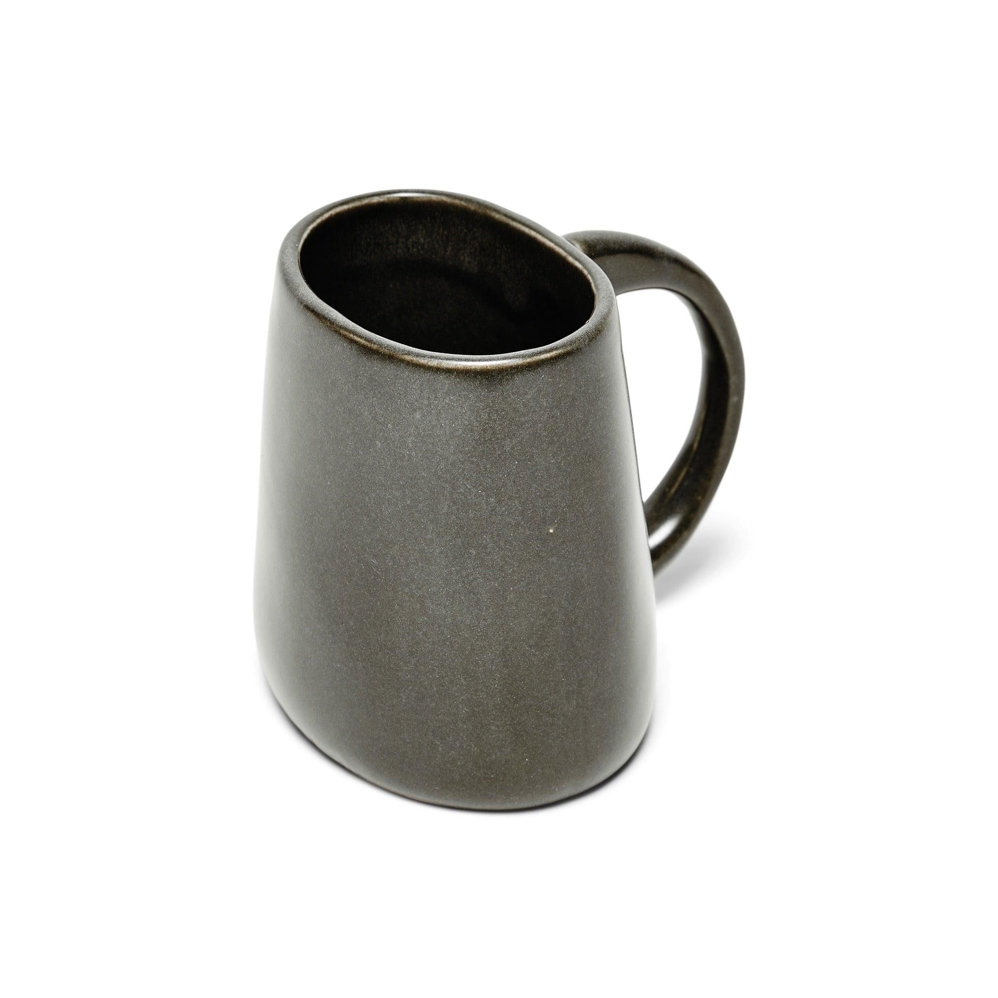 A ceramic mug with an oval shape and handle. Finished with a grey glaze.