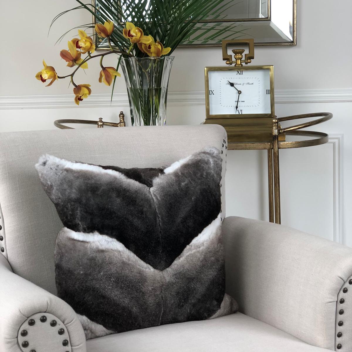 Add a layer of supreme luxe to your living room or bedroom decor with this exquisite grey rabbit fur pillow designed by Emily Barbara. Its unique chevron pattern offers a contemporary flavor paired with remarkable tones and opulent styling.