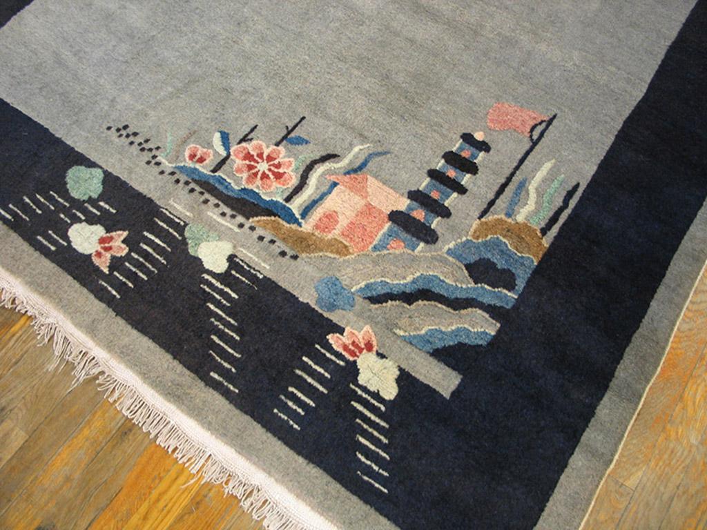 The open pearl grey field has a diagonally asymmetric pattern of a grape arbour in the top left and a pagoda in a rocky landscape in the lower right. The dark border adds a neat frame to the whole. This north-eastern Chinese Deco carpet dates from