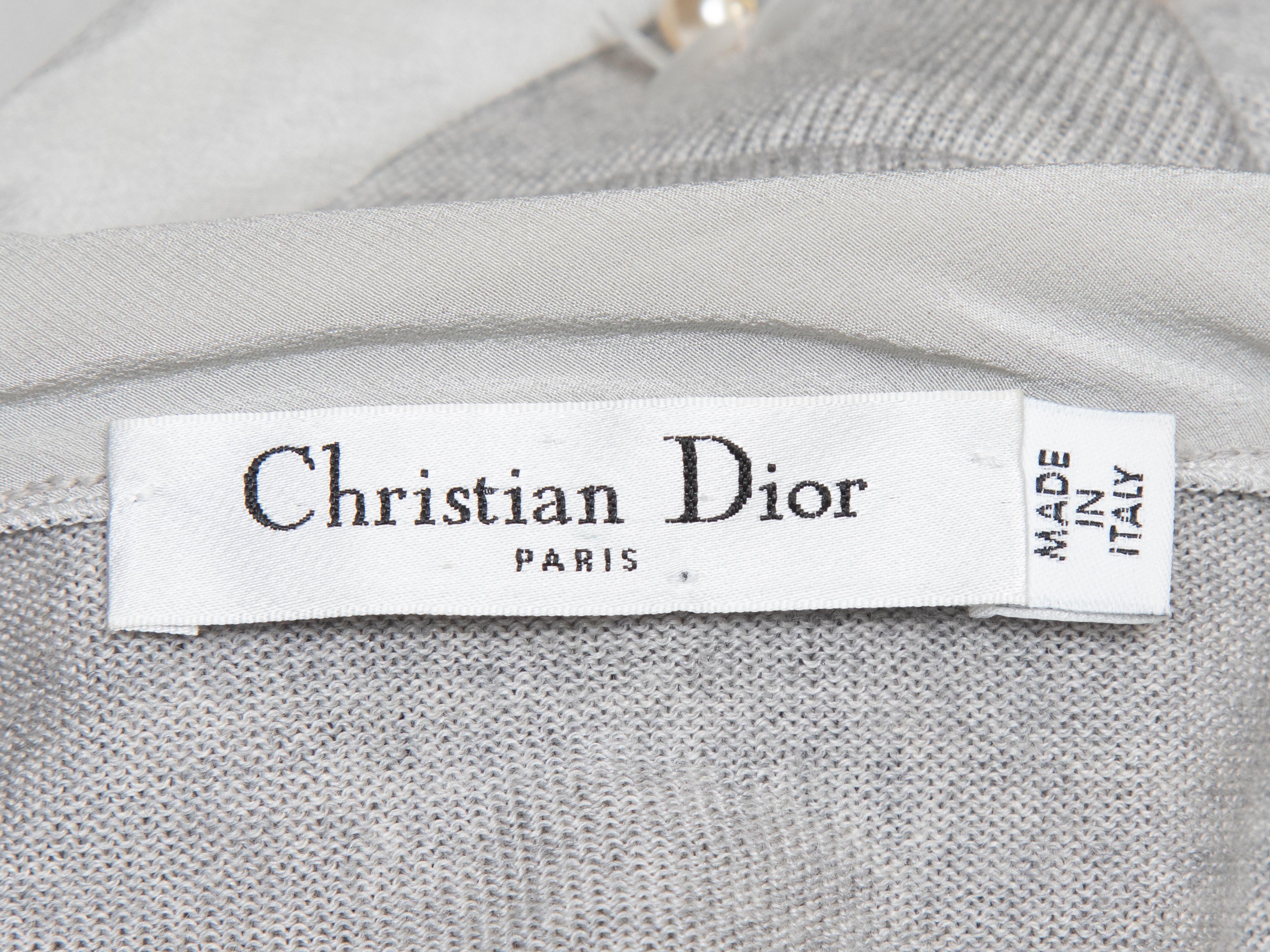 Grey wool-blend cardigan by Christian Dior. Pearl and sequin embellishments at front. Silk tie closure at front neck. 30