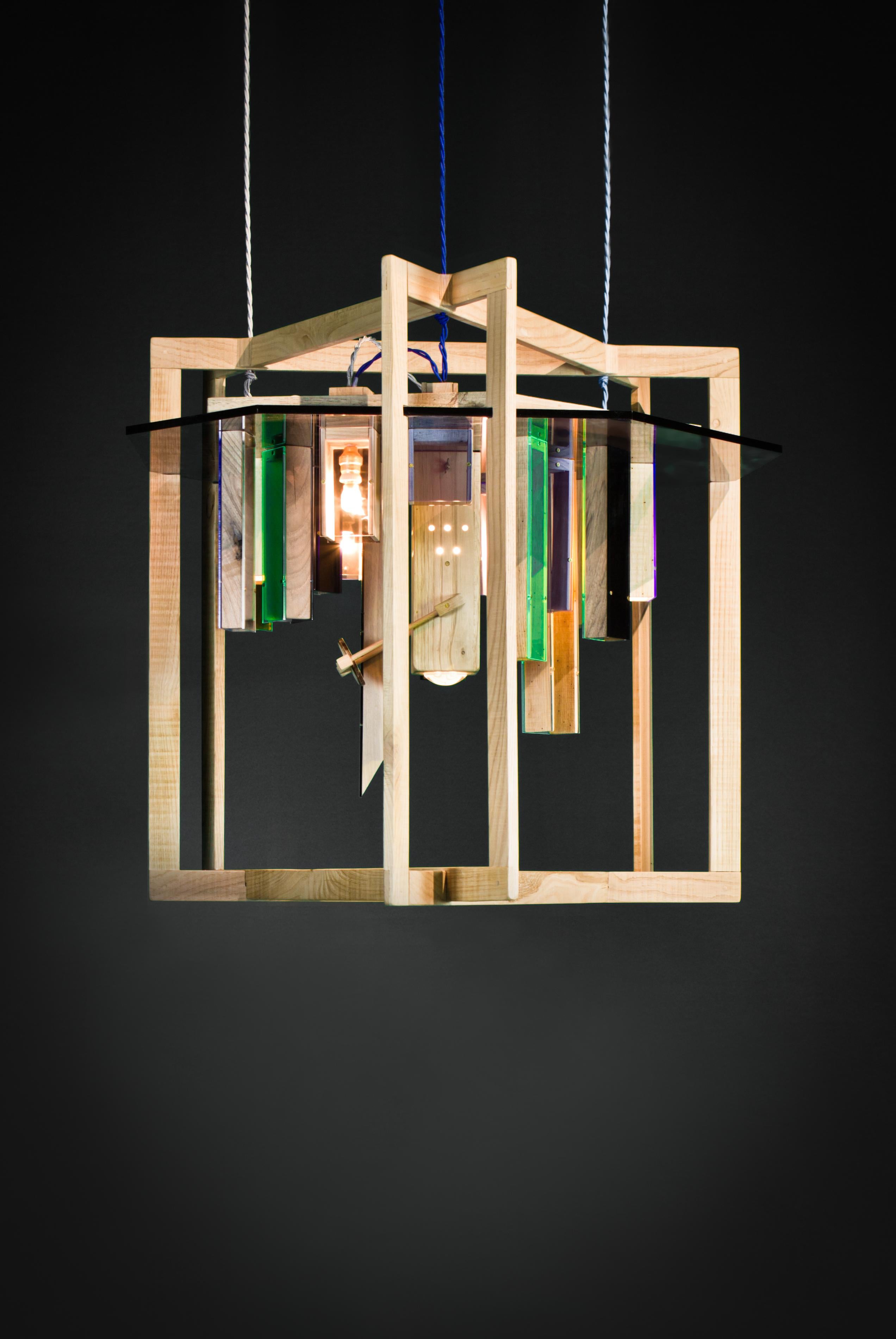 Grey Coloured Blooming Skyline Chandelier by Hillsideout
Dimensions: W 80-88 x D 60-80 x H 55-70 cm.
Materials: Handcrafted Chestnut, Nut and Elm Wood, Plexiglass, Screws of Brass, Lens, Slide.

Hillsideout is an Italian-German collaboration which