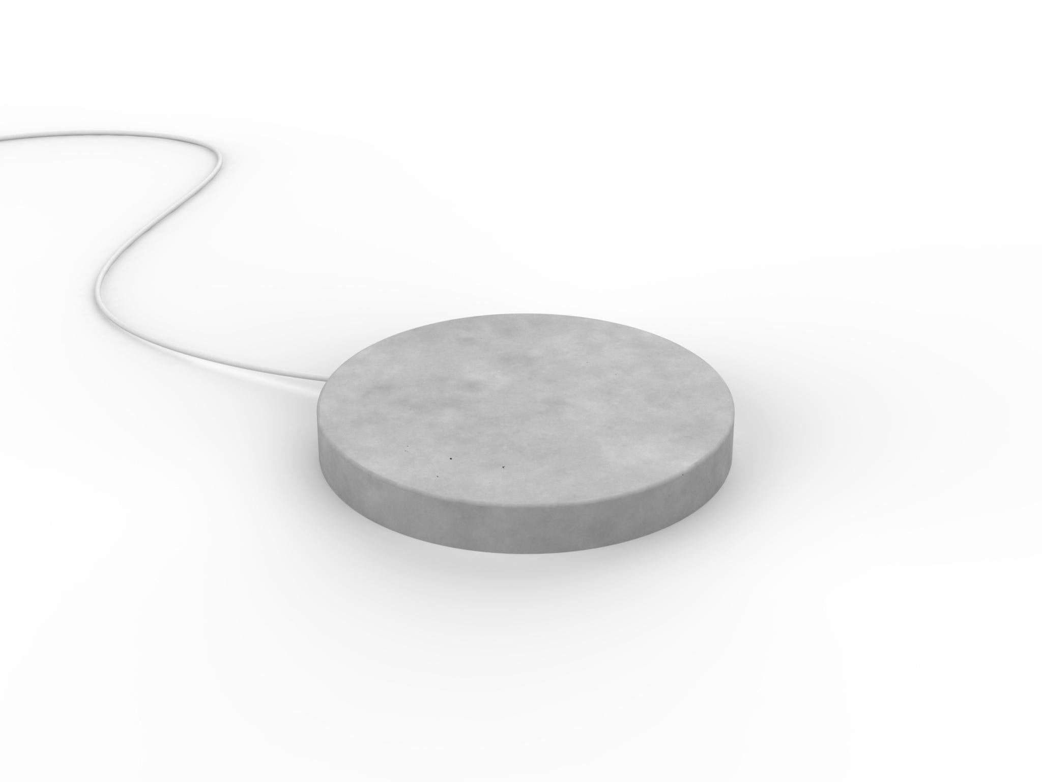 A Concrete base,
that quickly charge your phone, with a touch of magic.
 
A circle,
a stone,
realized with the care that Concrete requires.

A powerful wireless charging technology ensures an efficient and reliable power delivery.

The result is a