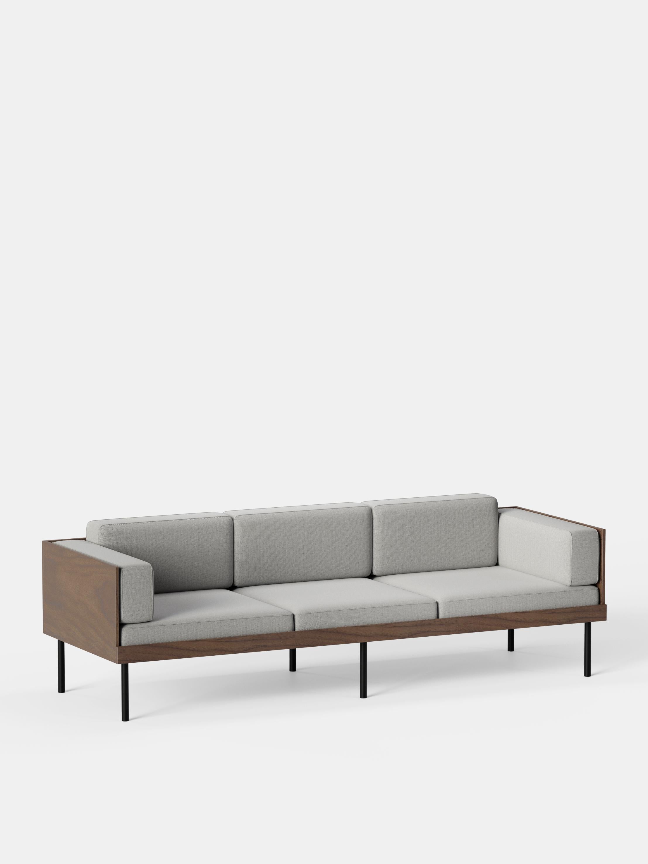 Grey Cut Sofa by Kann Design
Dimensions: D 80 x W 230 x H 72 cm.
Materials: Solid wood, steel, wood veneer, HR foam, fabric upholstery Kvadrat Remix 126 (90% wool, 10% nylon).
Available in other fabrics.

The Cut sofa has a deep, comfortable seat