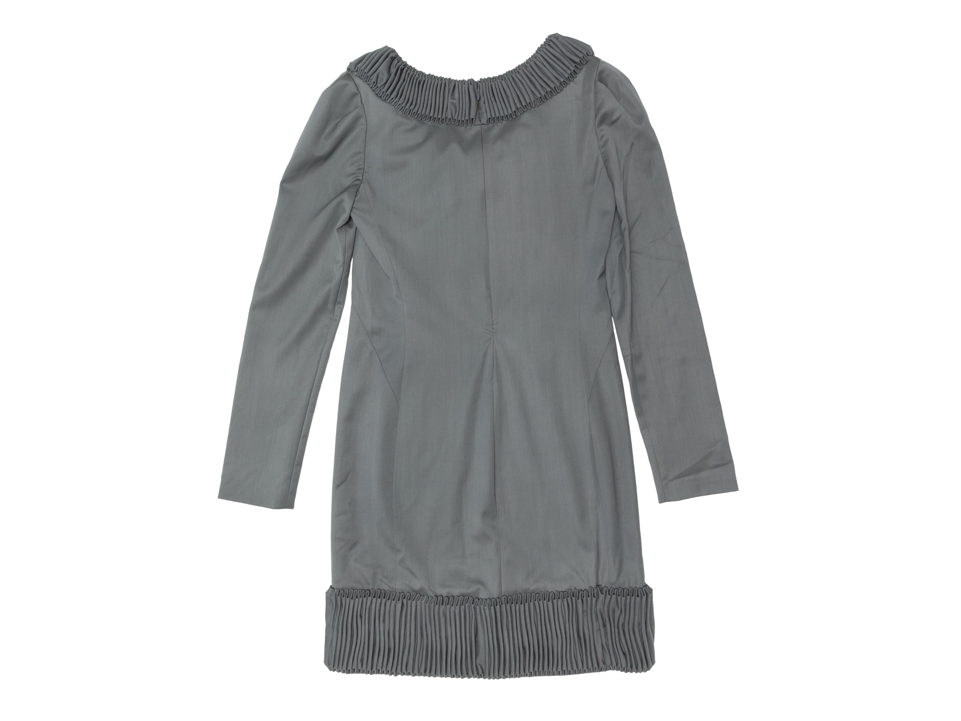 Grey long sleeve mini dress by Devi Kroell. Crew neck. Pleated trim throughout. Zip closure at center back. 28