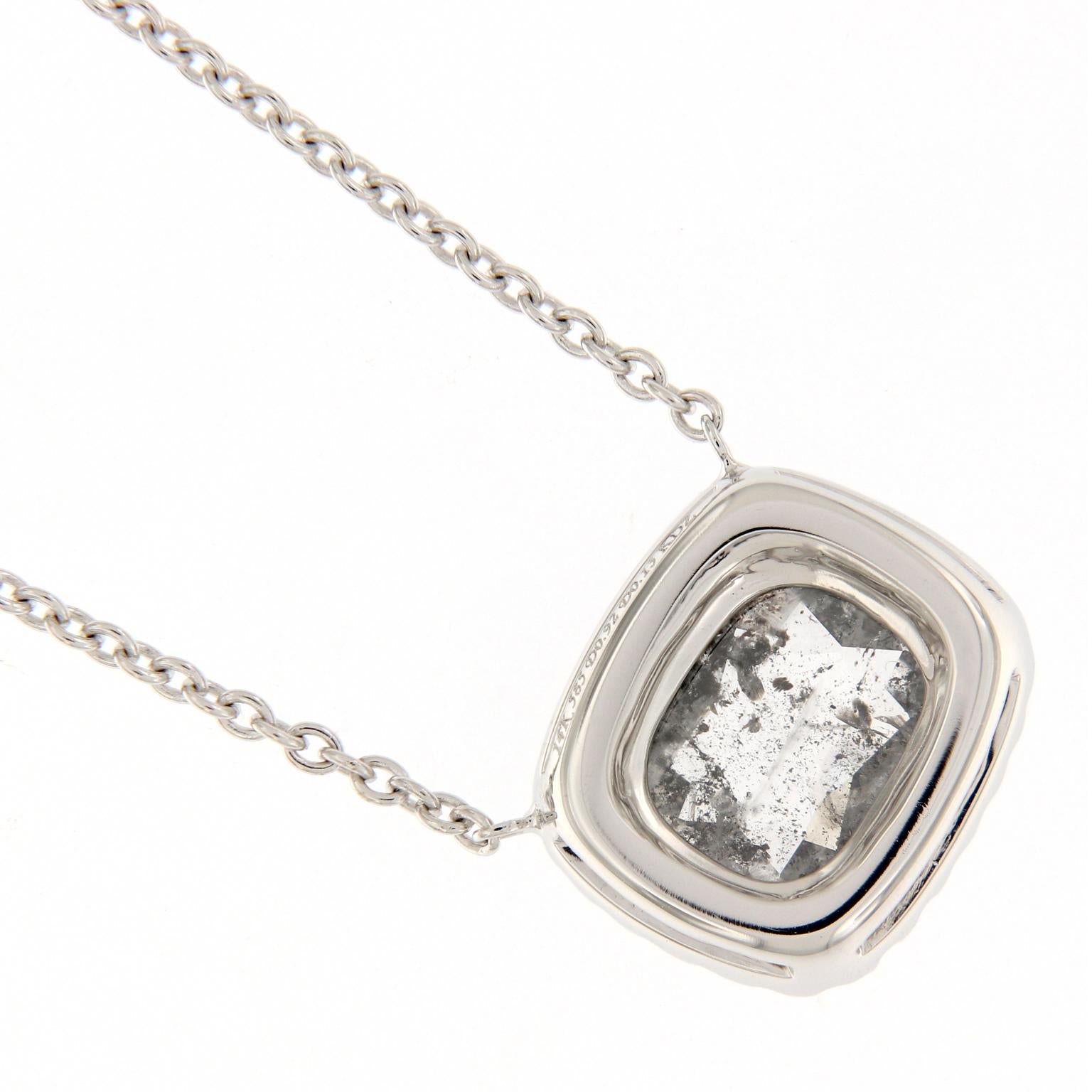 Pretty diamond halo pendant features a 0.92 carat grey, “salt and pepper” cushion rose-cut diamond. Pendant is on a 18 inch 14k white gold chain. Chain loops at 17 and 16 inches also. Weighs 3 grams.

White Diamonds 0.13 cttw.
Grey Diamond 0.92