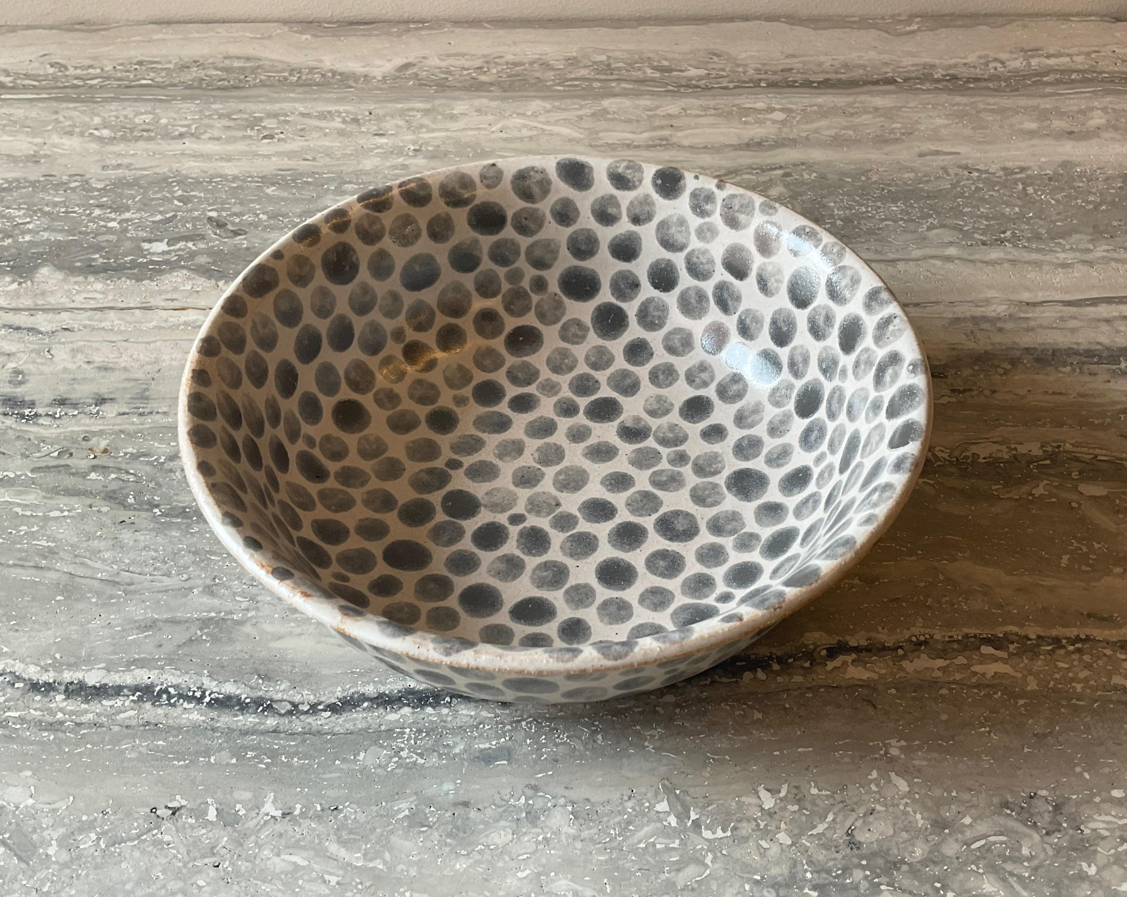 Soup bowl with curved mouth. Hand painted grey dots on white glazed stoneware. Thrown on a wheel. Made by hand in Tribeca NYC.