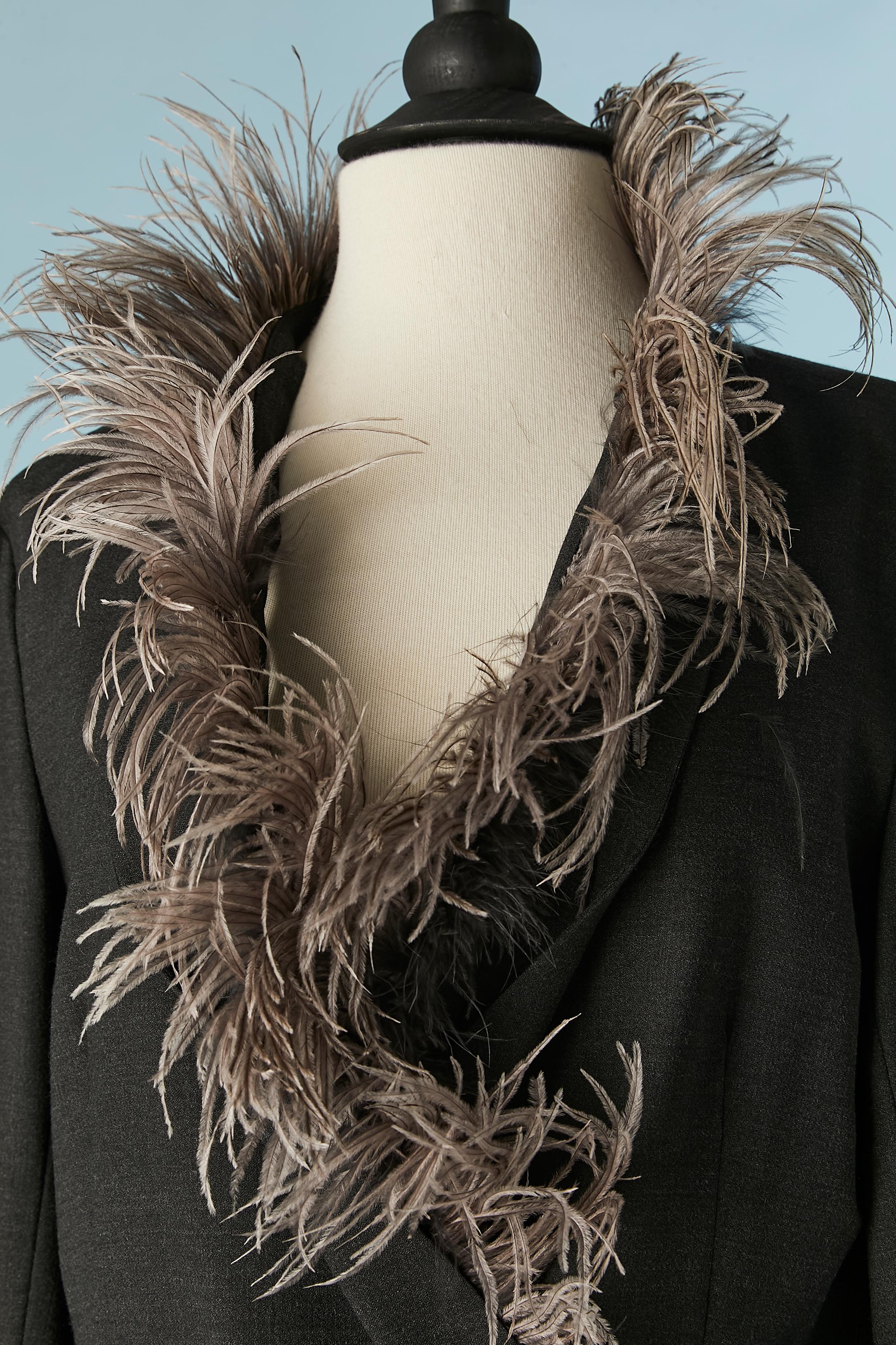 Dark grey double-breasted jacket with feather edge along neckline. 
Main fabric composition: 88% wool, 10% polyamide, 2% elasthane. No lining. 
Snap closure . Detachable feather band
SIZE 44 (It) 40 (Fr) 10 (Us) 
