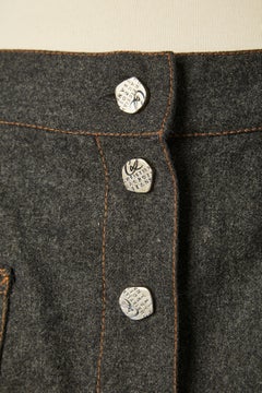 Grey flanelle skirt with snap closure middle front Jeans de Christian Lacroix