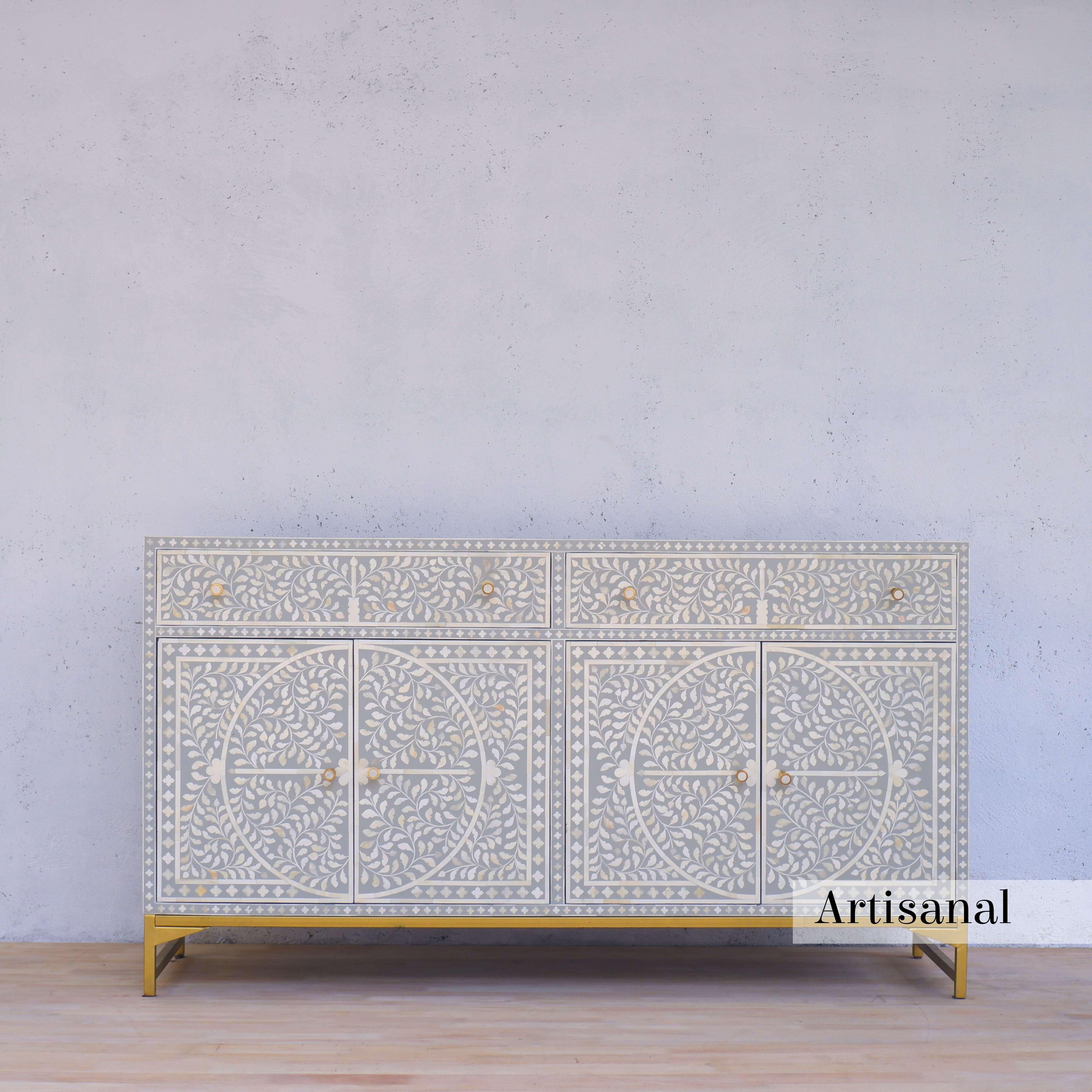 Elevate your home with Artisanal's exquisite grey inlay sideboard — a stunning addition that seamlessly blends timeless craftsmanship with modern sophistication.

Adorned with intricate foliate motif  patterns, this sideboard showcases the artistry