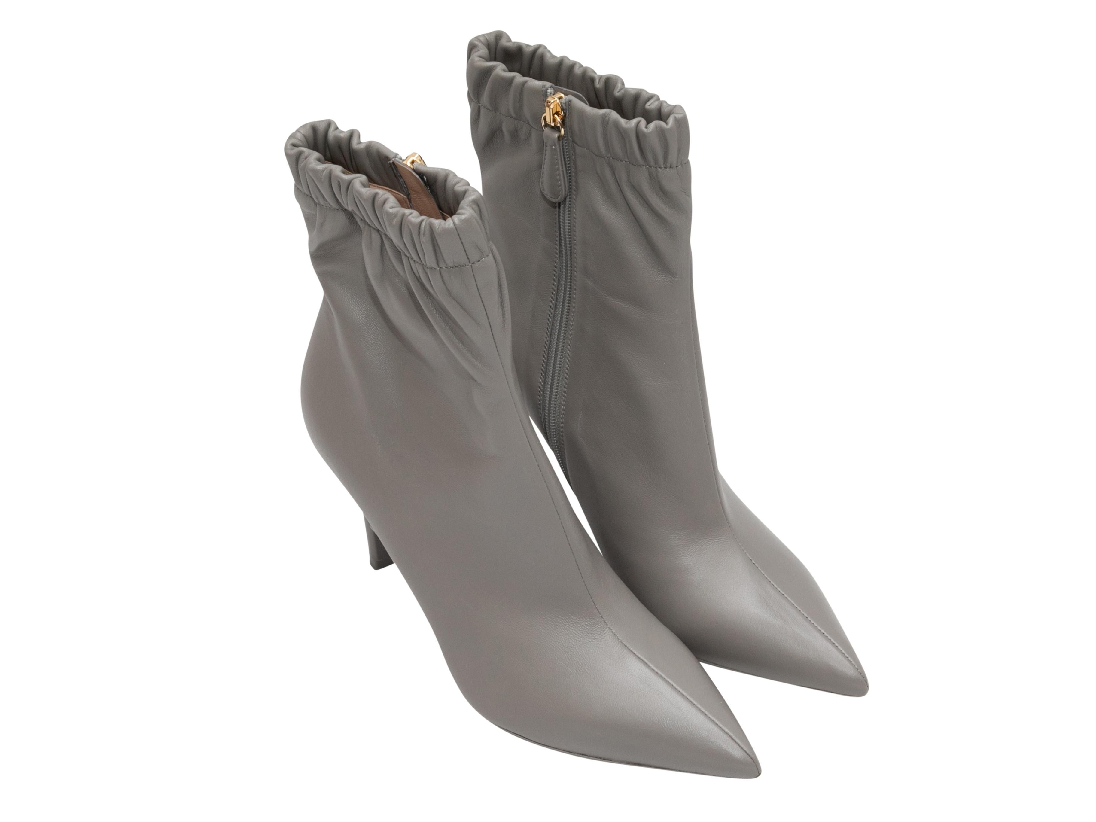 Grey leather Alina pointed-toe ankle boots by Gianvito Rossi. Zip closures at inner sides. 5.75