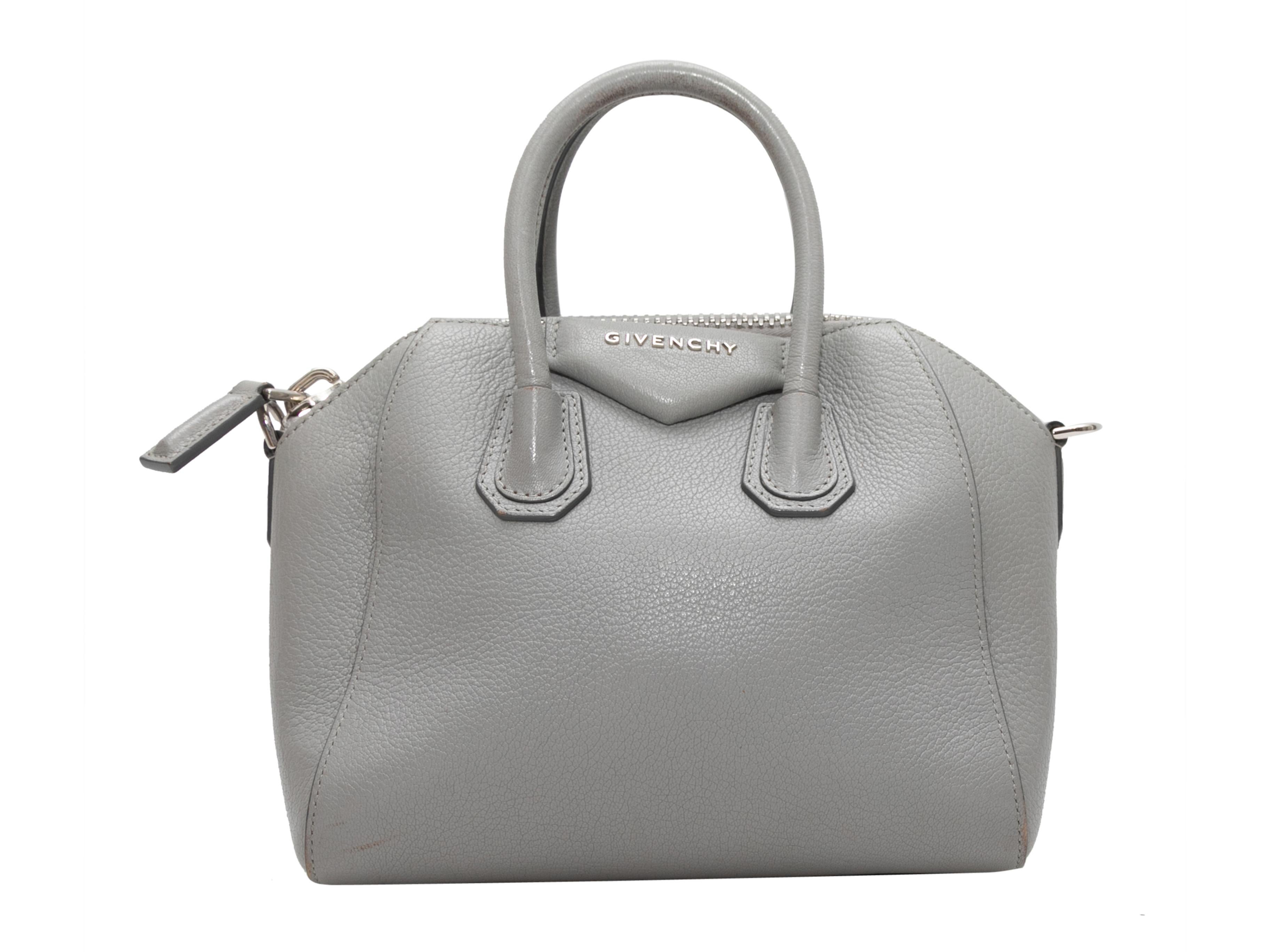 Grey Givechy Mini Antigona Handbag. The Mini Antigona Handbag features a leather body, silver-tone hardware, dual rolled top handles, a single flat shoulder strap, and a top zip closure. 11