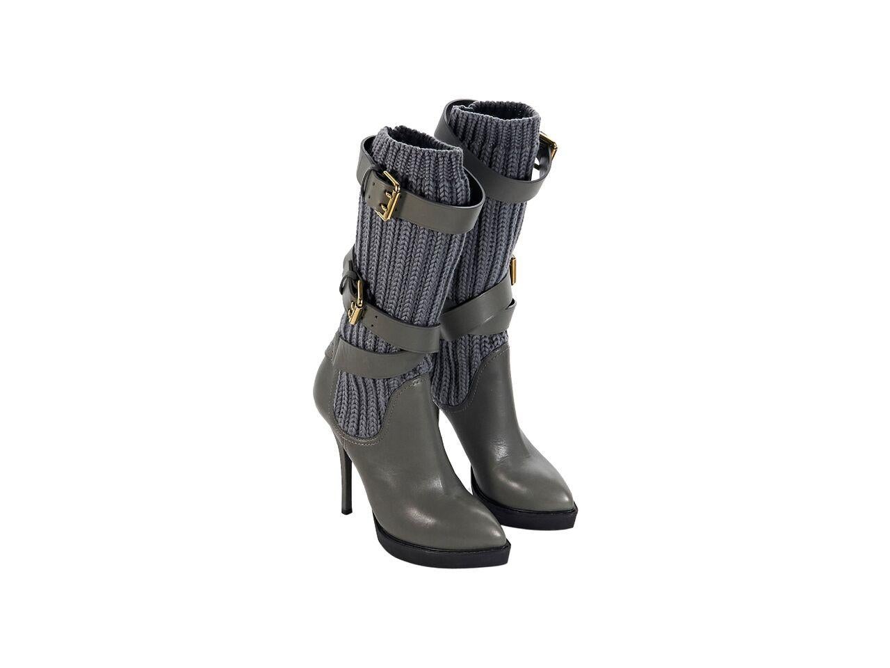 Product details:  Grey leather platform boots by Gucci.  Buckle straps accent knit shaft.  Pull-on style.  Goldtone hardware.  5