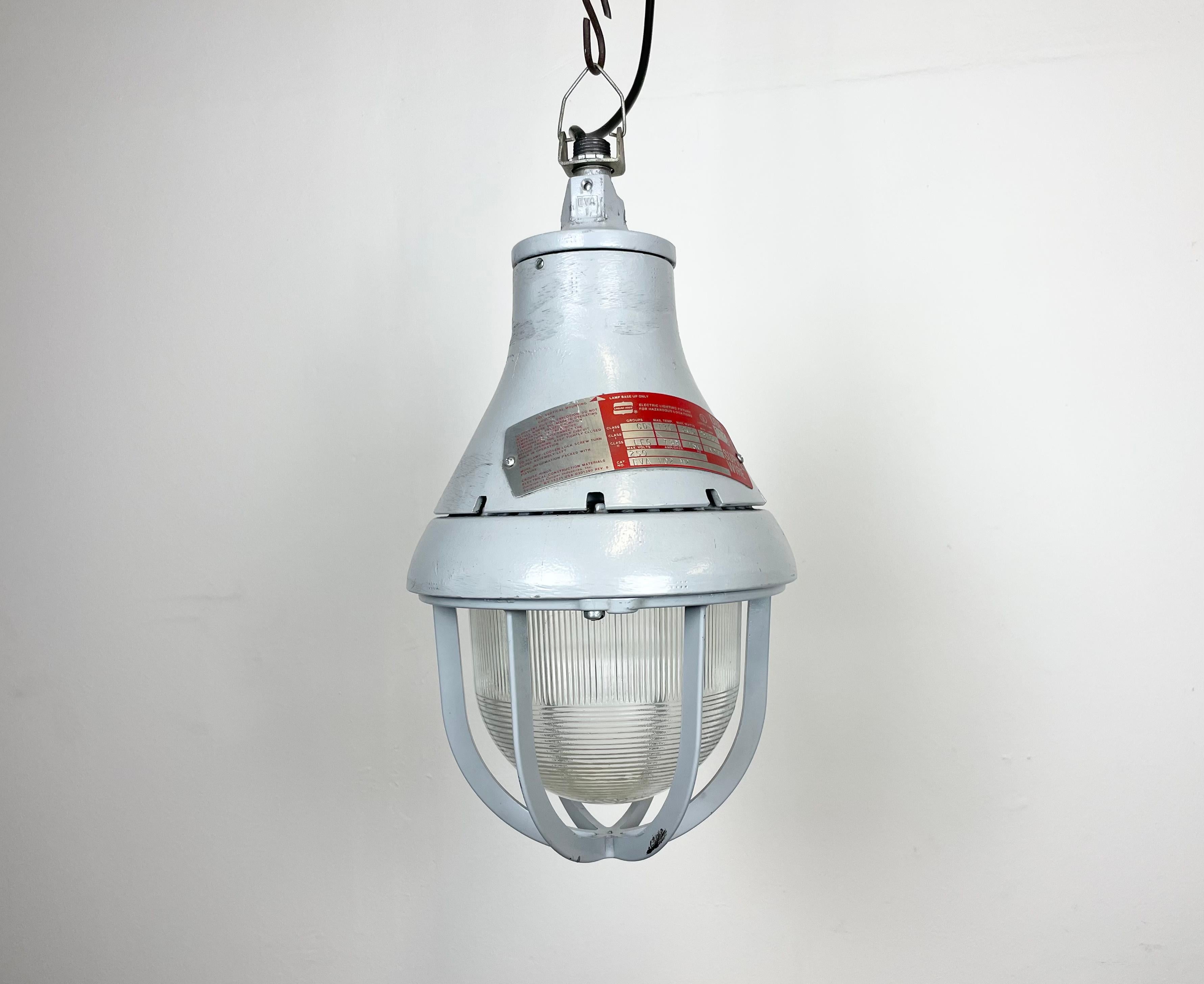 Industrial explosion proof light made by Crouse-Hinds in United States during the 1970s. It features a cast aluminium body and striped clear glass cover. The original socket requires E27/ E26 light bulbs.The weight of the lamp is 5 kg. New wire.