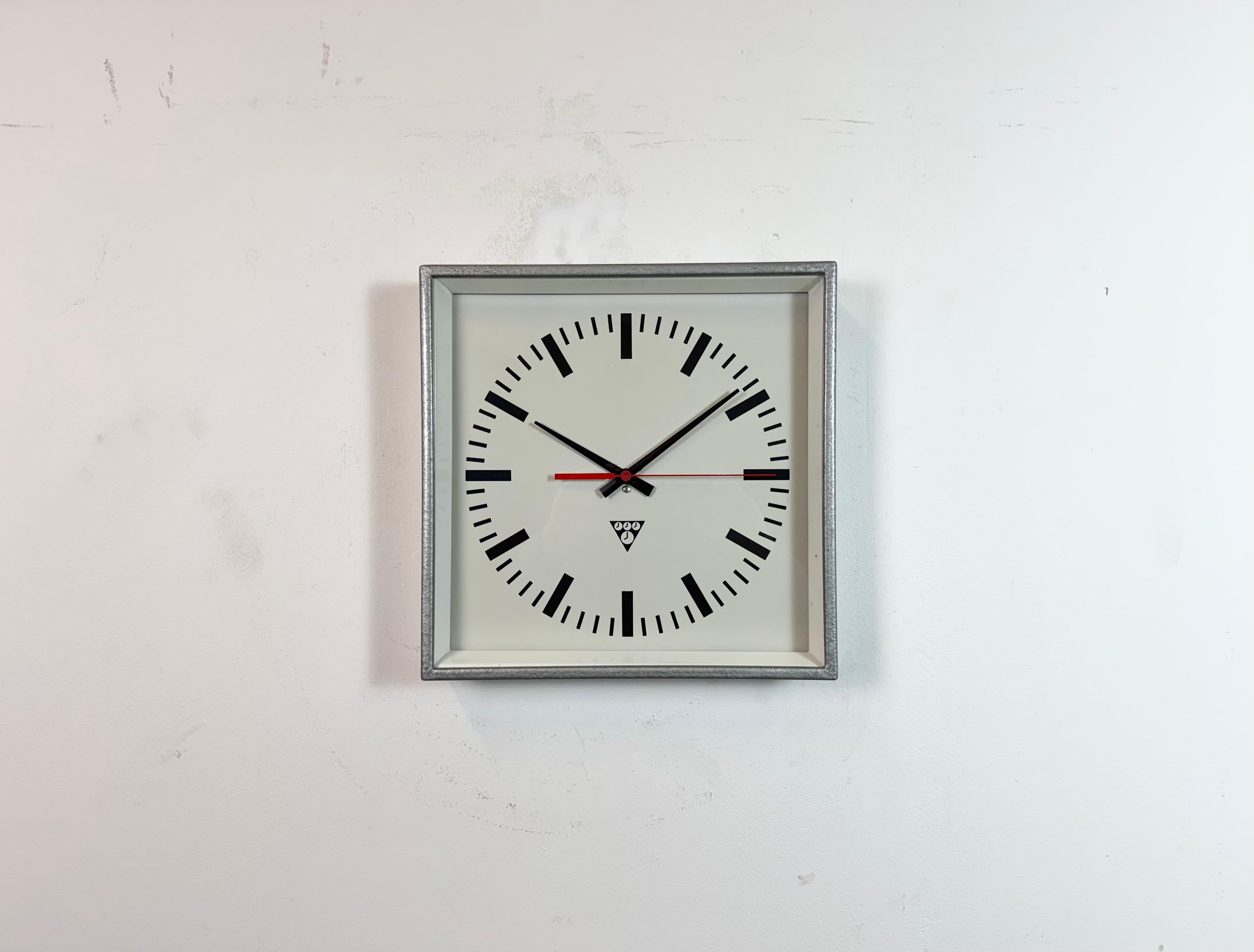 - Wall clock designed by Pragotron in former Czechoslovakia during the 1970s and made till 1990s
- Was used in factories, schools and railway stations 
- Grey hammerpaint metal frame
- Aluminium dial and hands 
- Clear glass cover 
- Former electric