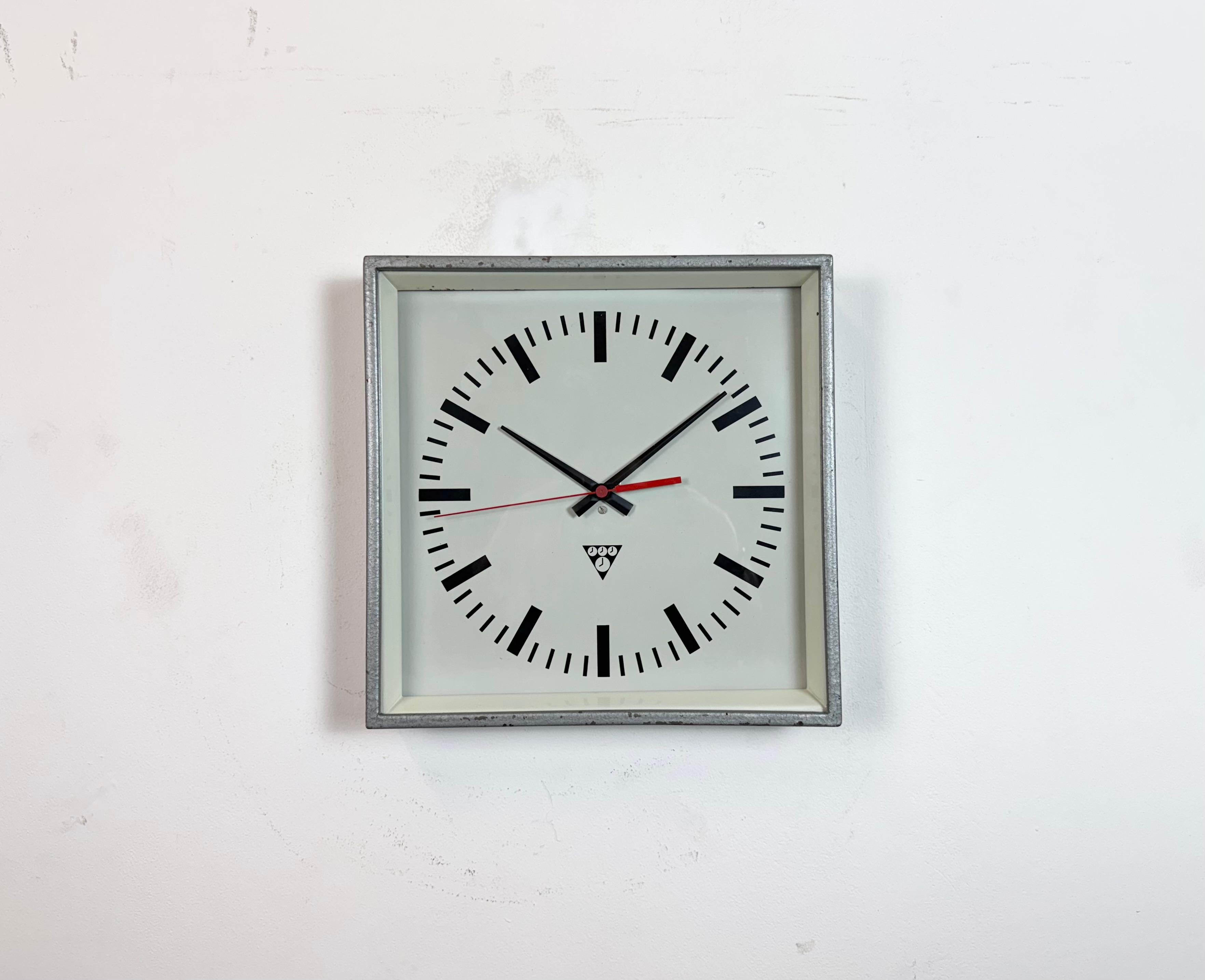 - Wall clock designed by Pragotron in former Czechoslovakia during the 1970s and made till 1990s
- Was used in factories, schools and railway stations 
- Grey hammerpaint metal frame
- Aluminium dial and hands 
- Clear glass cover 
- Former electric