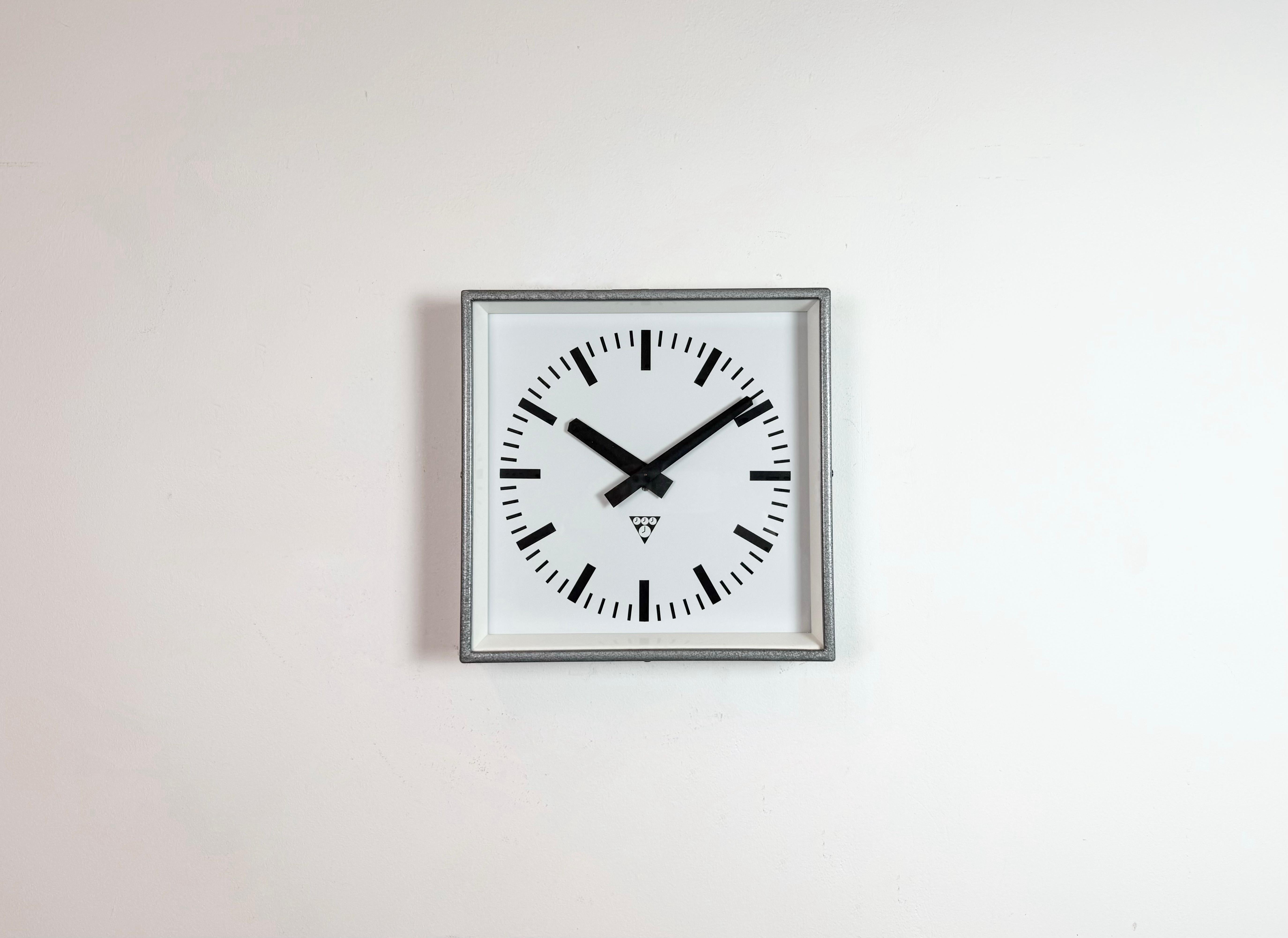 - Wall clock designed by Pragotron in former Czechoslovakia during the 1970s and made till 1990s
- Was used in factories, schools and railway stations 
- Grey hammerpaint metal frame 
- Aluminium dial and hands 
- Clear glass cover 
- Former