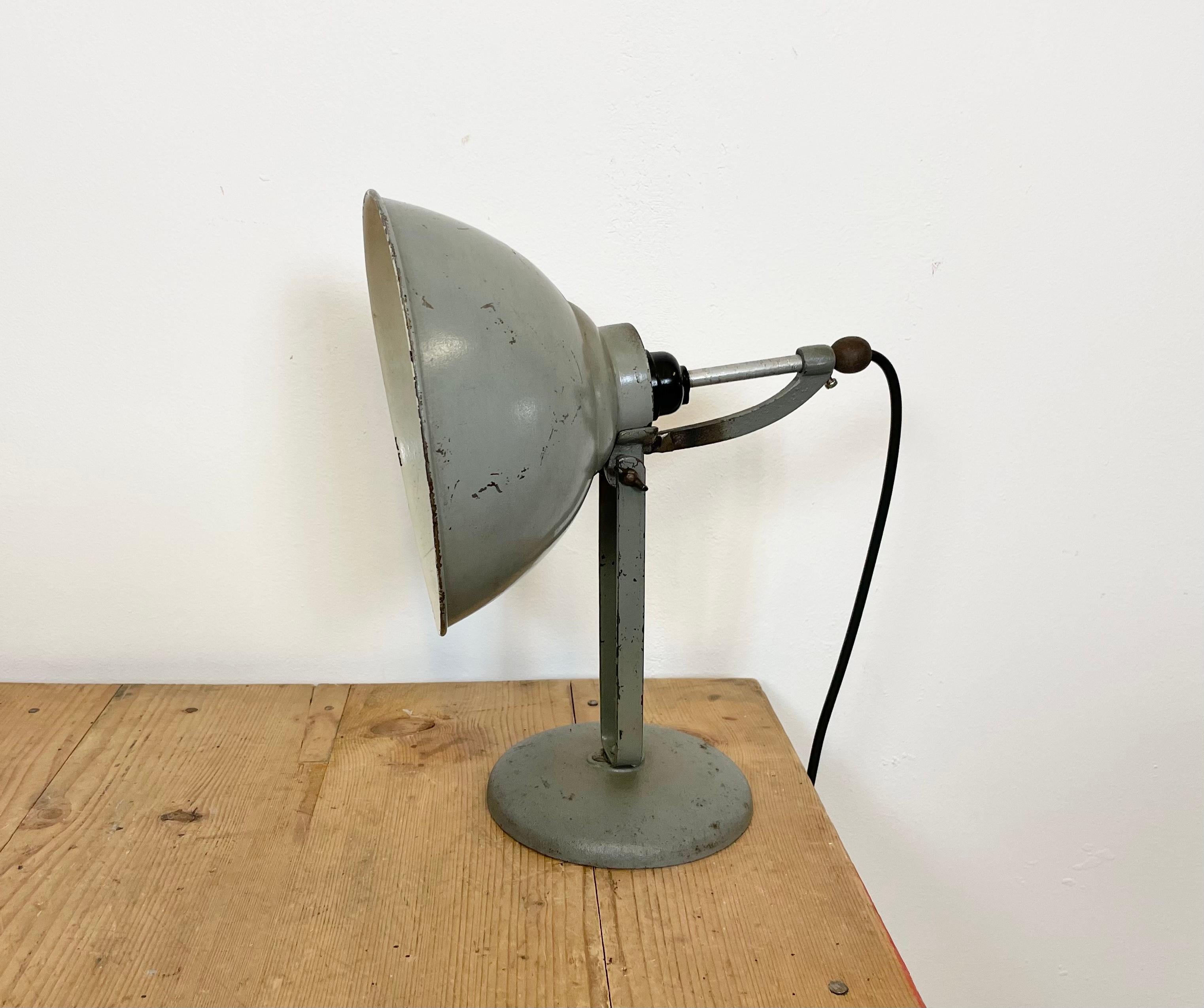 - Industrial table lamp manufactured in former Czechoslovakia during the 1970s
- Cast Iron base and adjustable iron shade
- Porcelain socket requires E 27 light bulbs
- New wire
- The weight of the lamp is 1,2 kg.