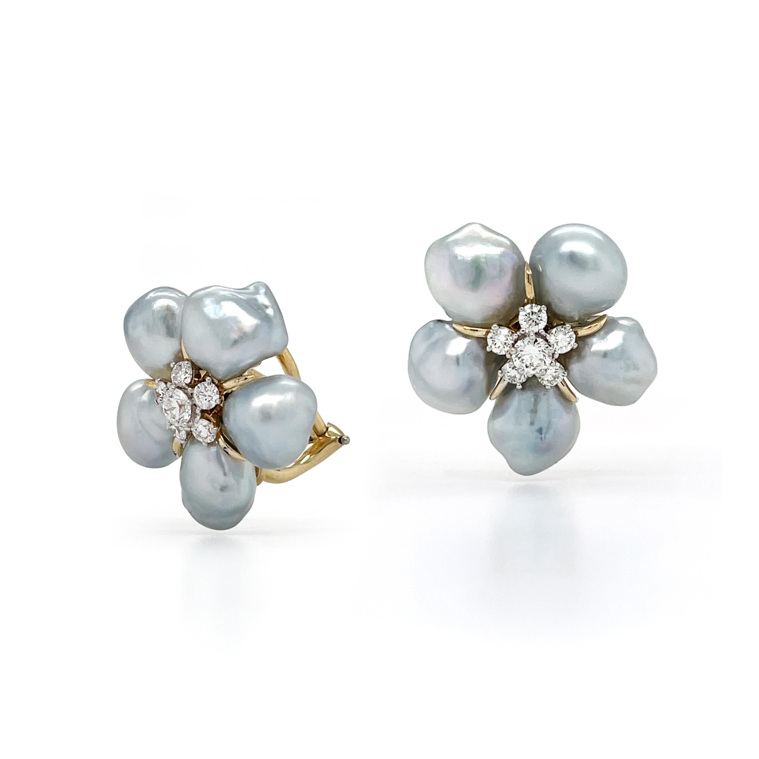 A silky luster emits from the silver-grey Tahitian Keshi pearls for these earrings. Five baroque-shaped pearls are secured by 18k yellow gold to form a flower contour. Each pearl is slightly different from the other, showcasing ridges and valleys.