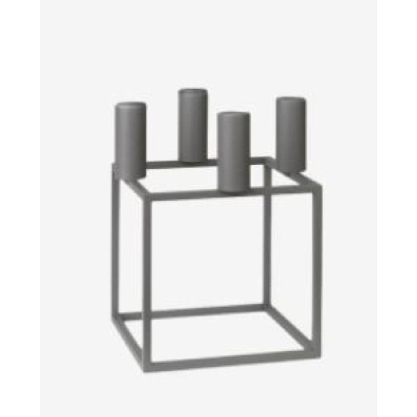 Grey Kubus 4 candle holder by Lassen
Dimensions: D 14 x W 14 x H 20 cm 
Materials: Metal 
Also available in different dimensions. 
Weight: 1.50 Kg

A new small wonder has seen the light of day. Kubus Micro is a stylish, smaller version of the