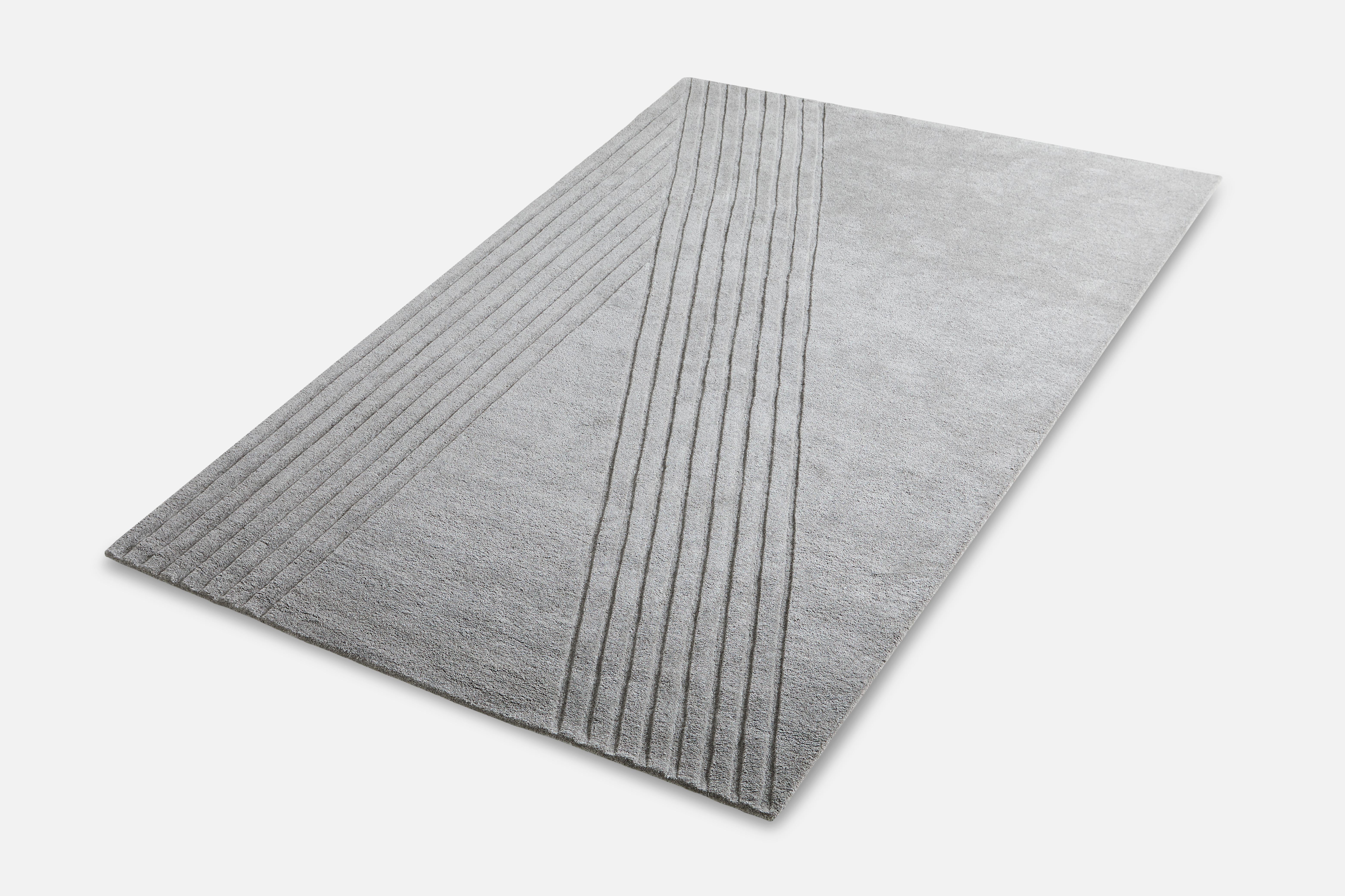 Grey Kyoto rug IV by AD Miller
Materials: 80% wool, 20% cotton.
Dimensions: W 200 x L 300 cm
Available in grey or off white.

The hand-tufted wool rug, Kyoto, takes its inspiration from the distinctive pattern found in traditional raked