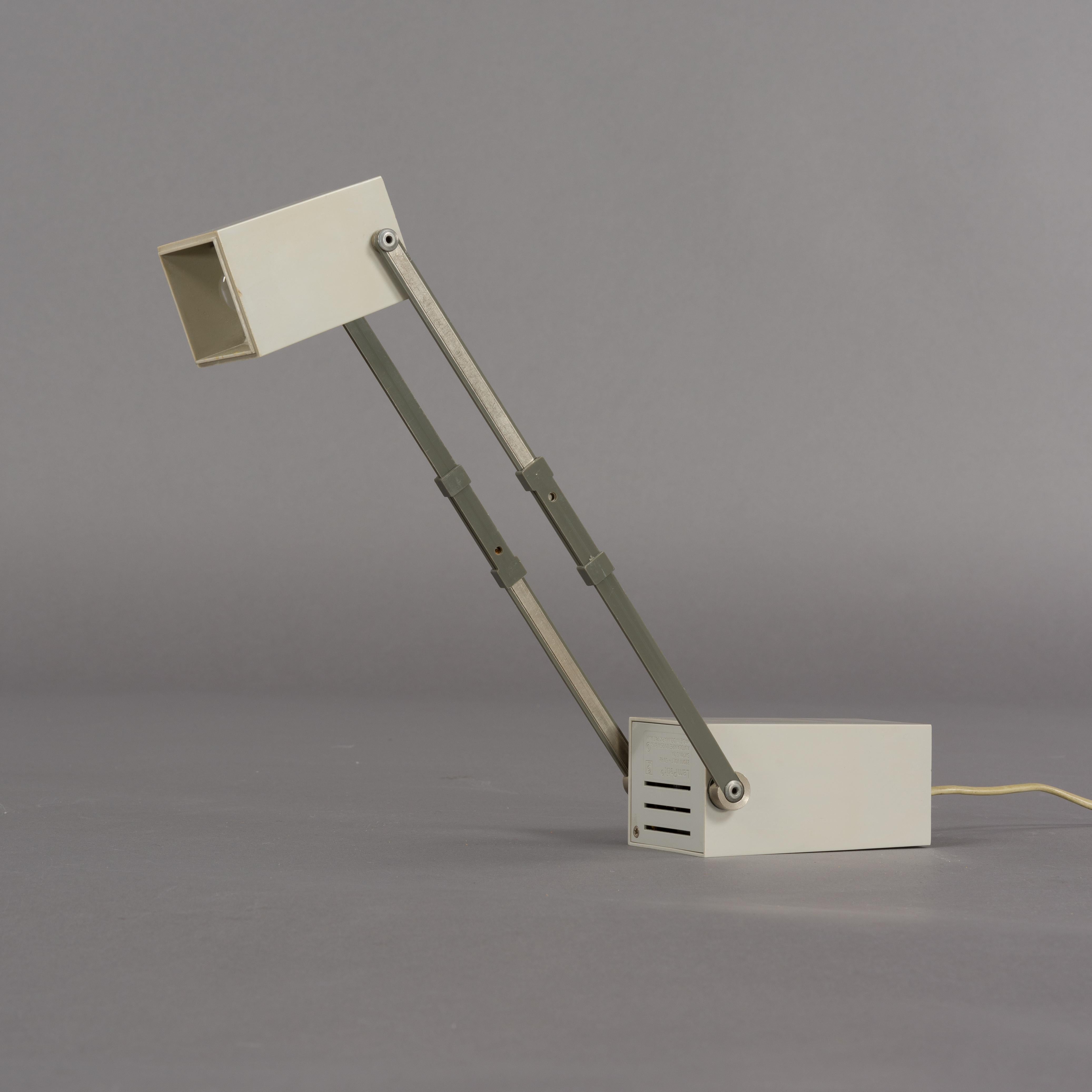 Lampetit lamp in grey designed by Verner Panton for Louis Poulsen in 1966. A small compact lamp with rectangular shapes that was ahead of its time. This lamp is often attributed to the Louis Poulsen design team, however, after the death of Verner