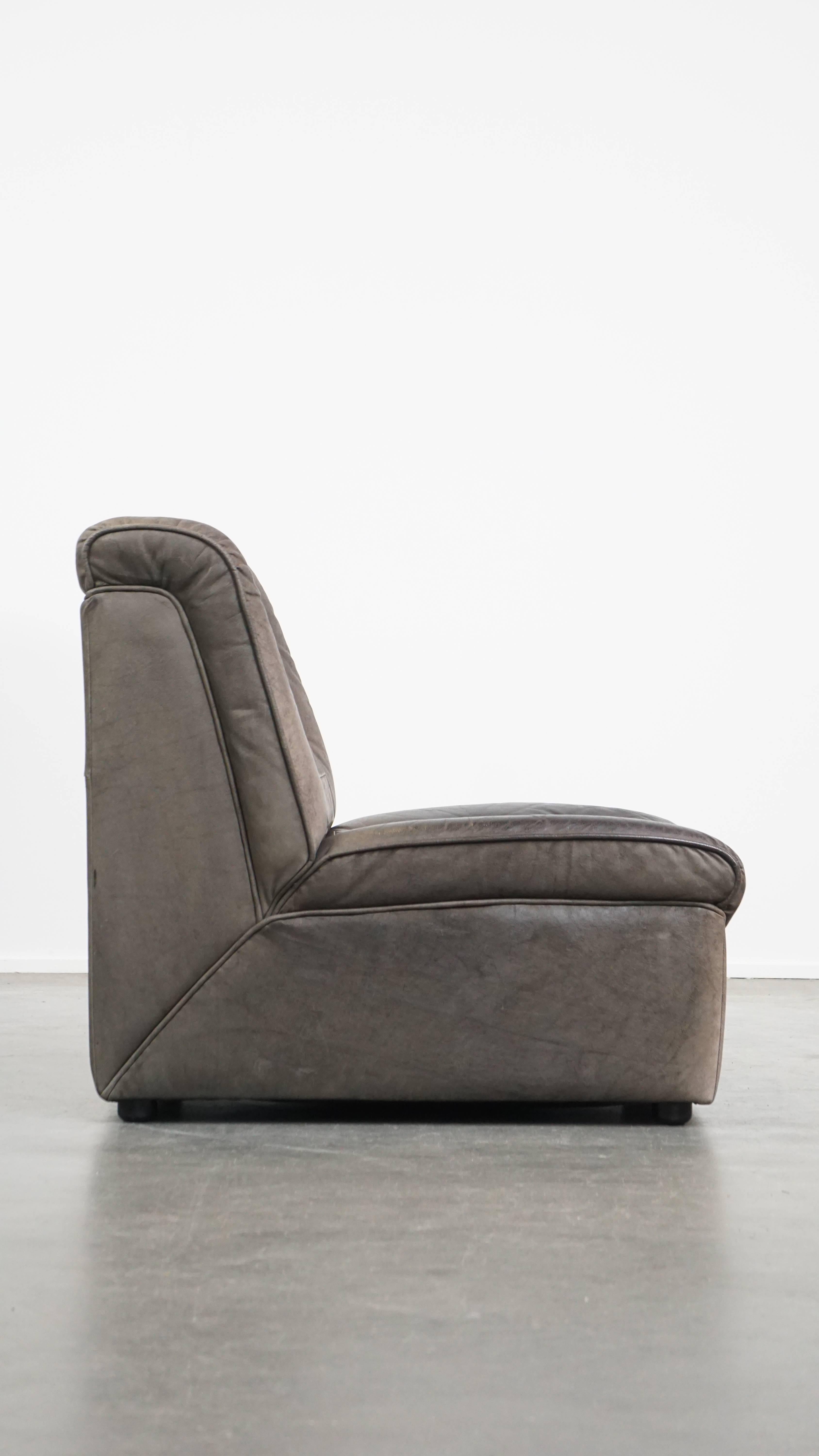 Offered grey vintage leather elements design sofa 3 elements + footstool.

This nice element sofa comes from the 70s and has a beautiful vintage look combined with a nice lounge / seating comfort. It has acquired some traces of use through years of
