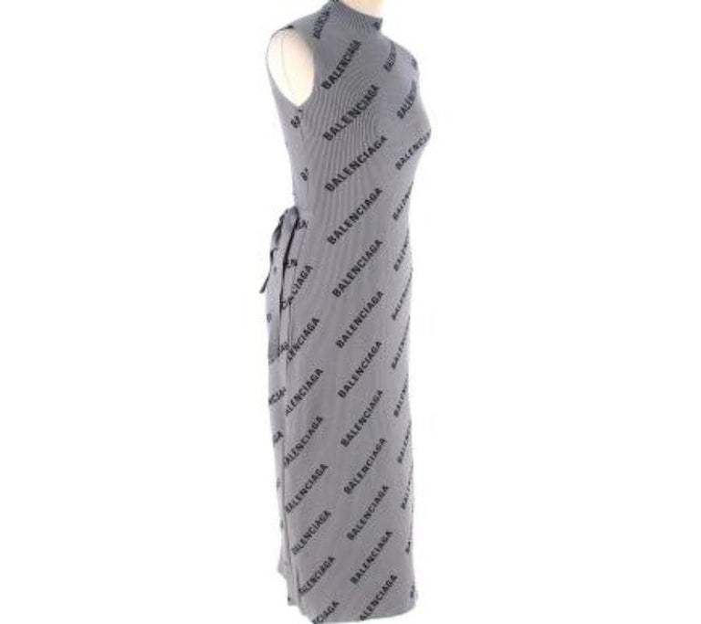 Balenciaga Grey Logo Printed Ribbed-Knit Dress
 
 - Warm grey with allover diagonal logo print
 - Mock neck, sleeveless
 - Wrapover, with self-tie waistband
 - Ankle length
 
 Materials 
 100% Polyamide 
 
 Made In Italy 
 Professional Dry Clean