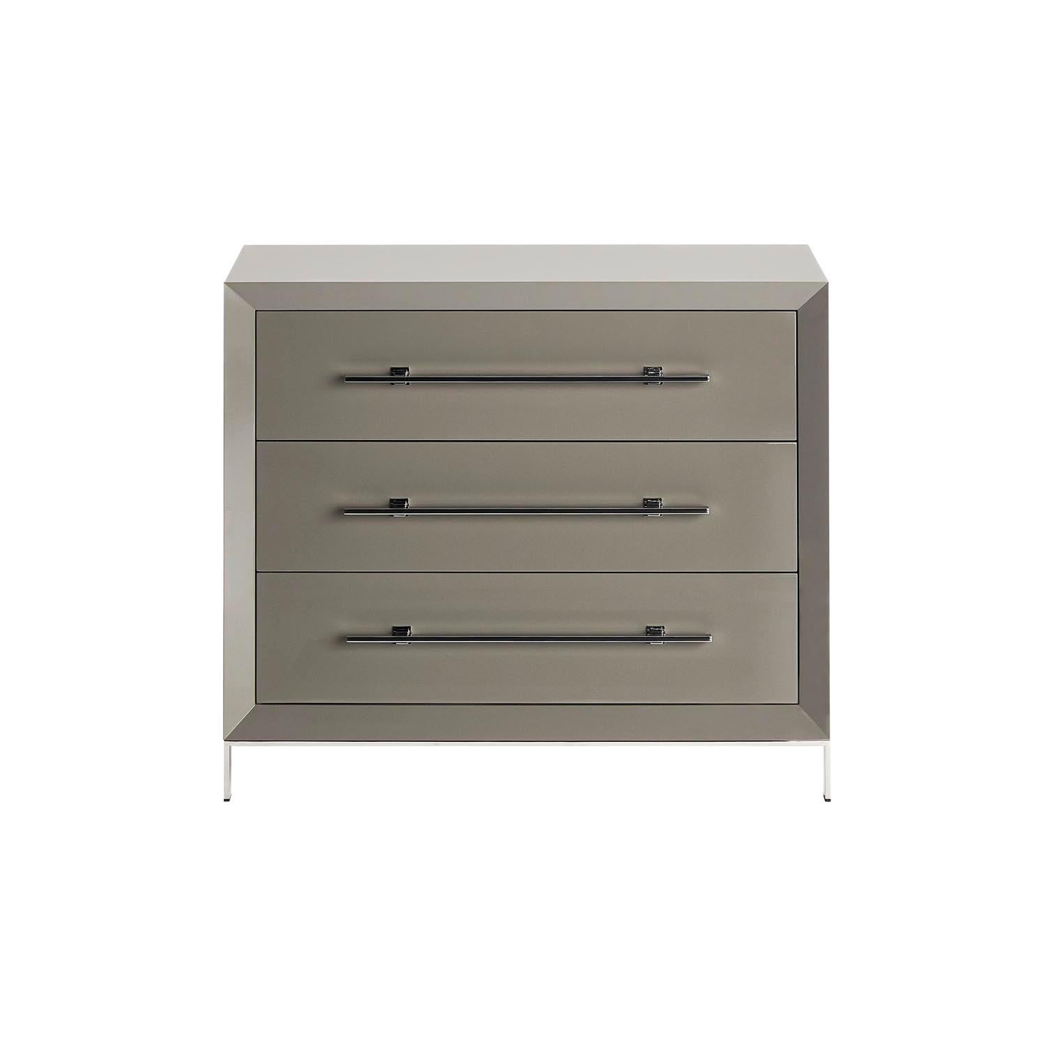 Magna is a classic style chest of drawers with three drawers to simplify storage and keeping the elegance of the bedroom.
Glossy lacquer structure in grey S6502-Y color, combined with polished stainless steel handles and feet.