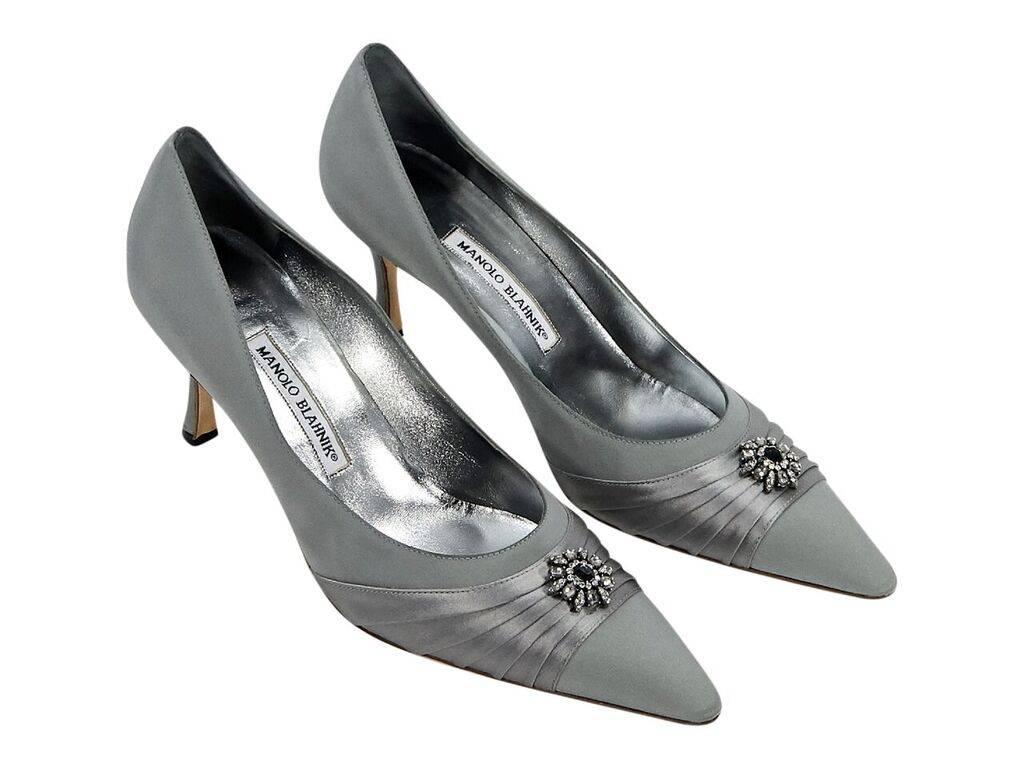 Product details:  Grey satin evening pumps by Manolo Blahnik.  Pleated detail and embellishment at vamp.  Point toe.  Slip-on style.  Dust bag included.  Label size EU 41.5.  3