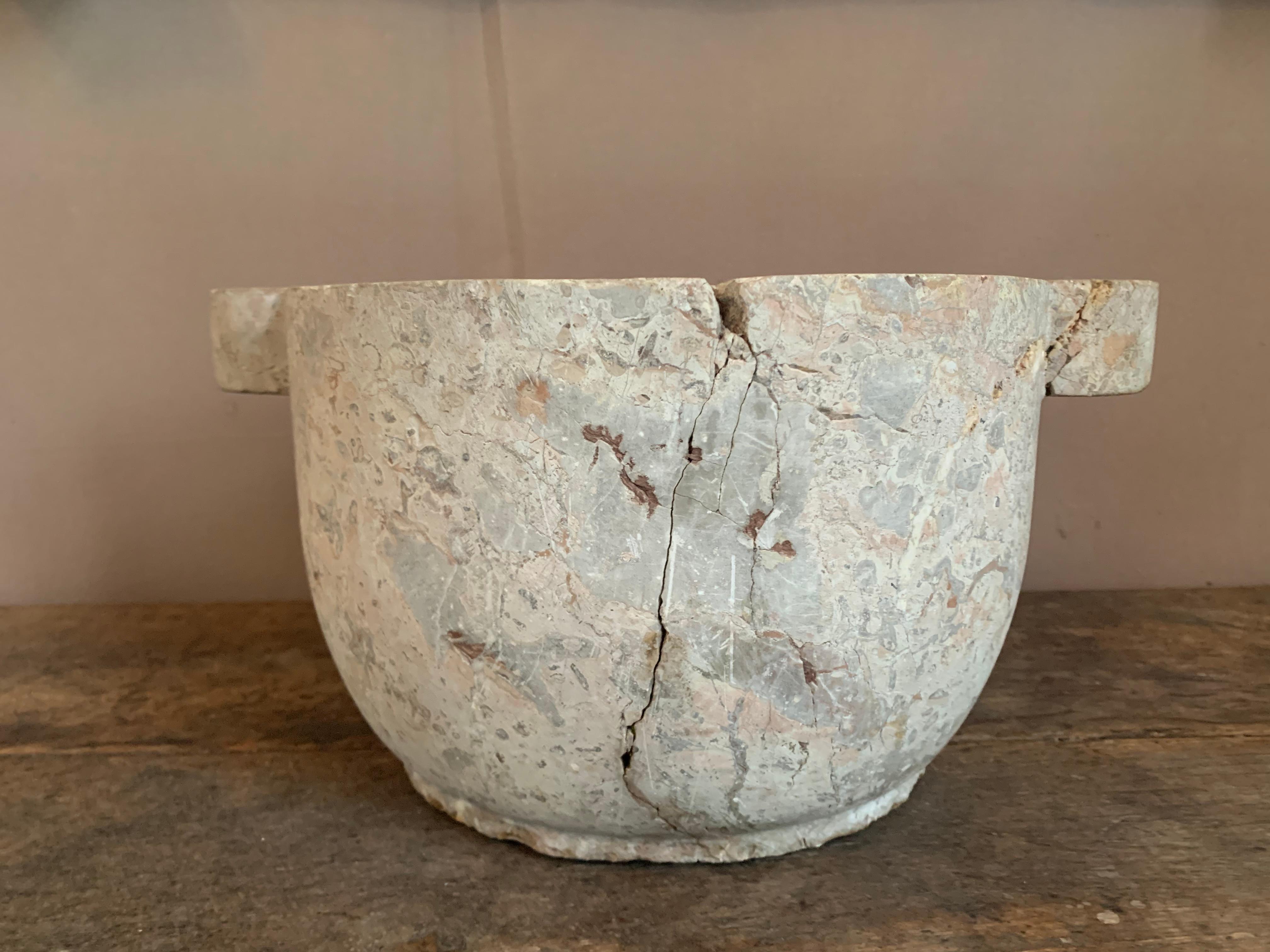 Antique large marble mortar of the high period. Dating from the late Middle Ages, early Renaissance. This mortar is made of grey marble.
The mortar was once used to grind different materials for food or medicine.