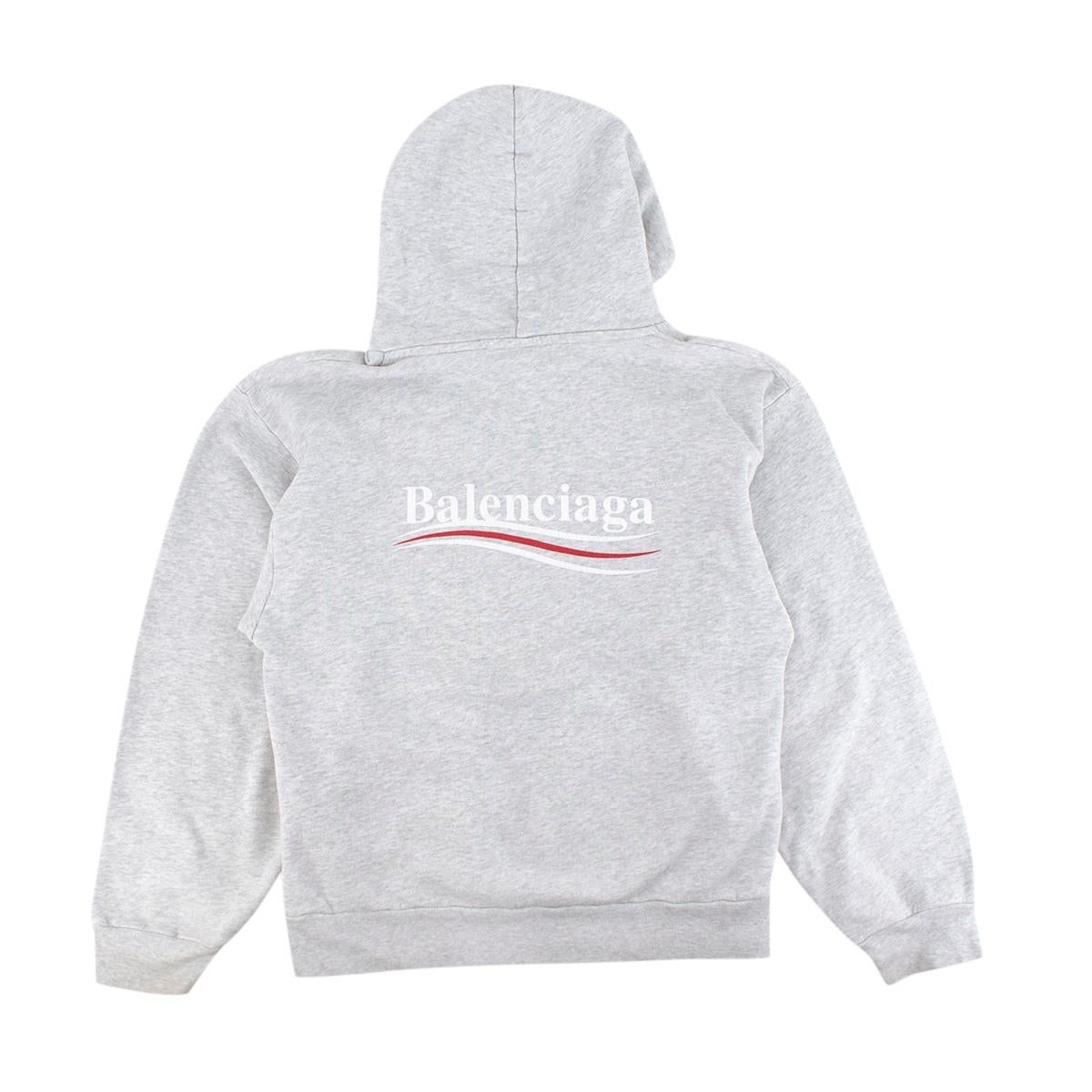 Balenciaga Grey Marl Cotton Jersey Logo Hoodie 

- Political style logo on the chest and across the back
- Hooded 
- Ribbed hemline and cuffs 
- Kangaroo pouch pocket 

Materials 
90% Cotton 
10% Polyester 

Made In Portugal 

Hand Wash 

9 Very