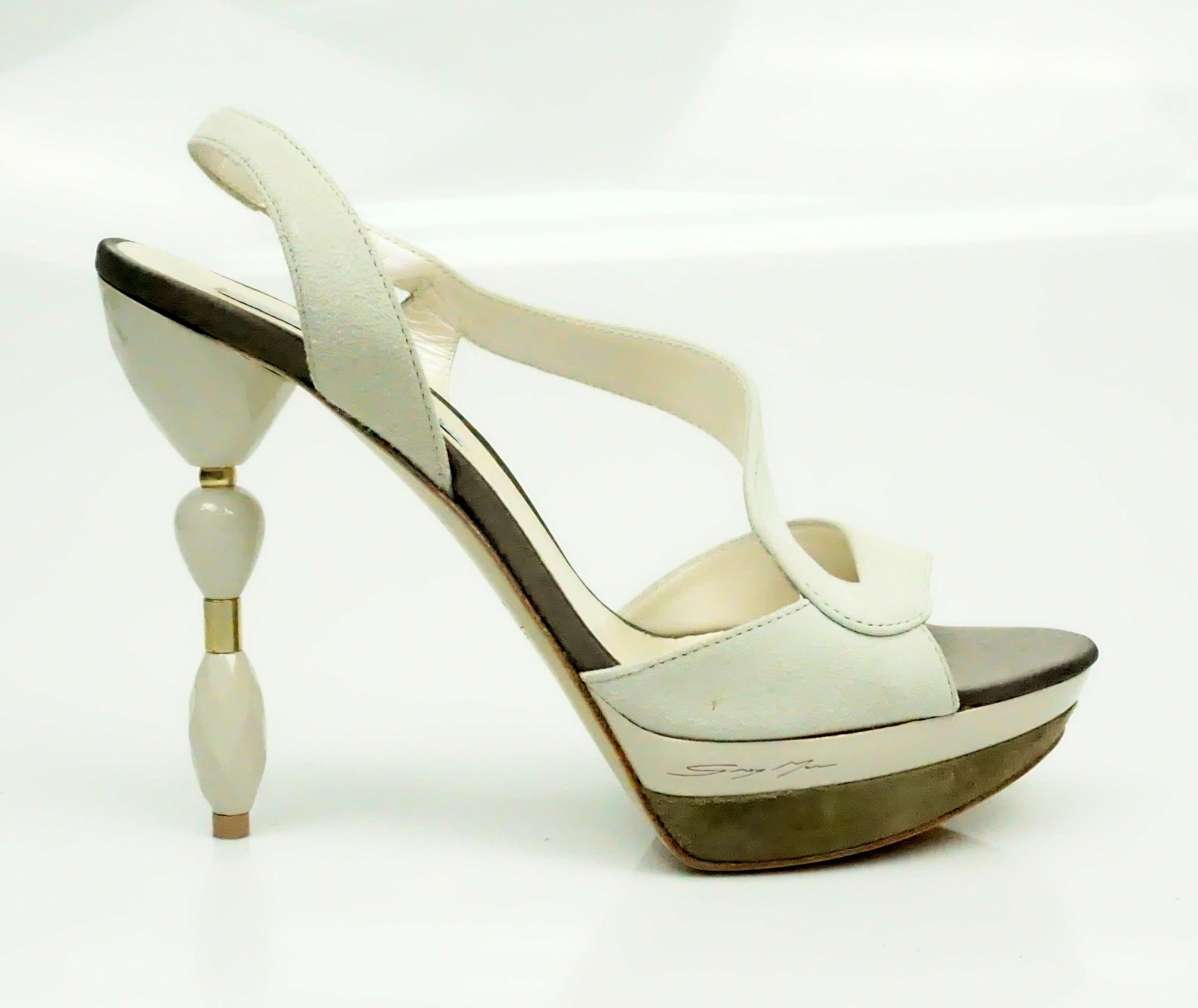 Grey Mer Bone Suede Sandal w/ Acrylic Heel - 37  These unique heels are in excellent condition. The bottom of the heels seem to look as if they have never been worn. There is a suede and patent leather platform on the shoe and the heel has an