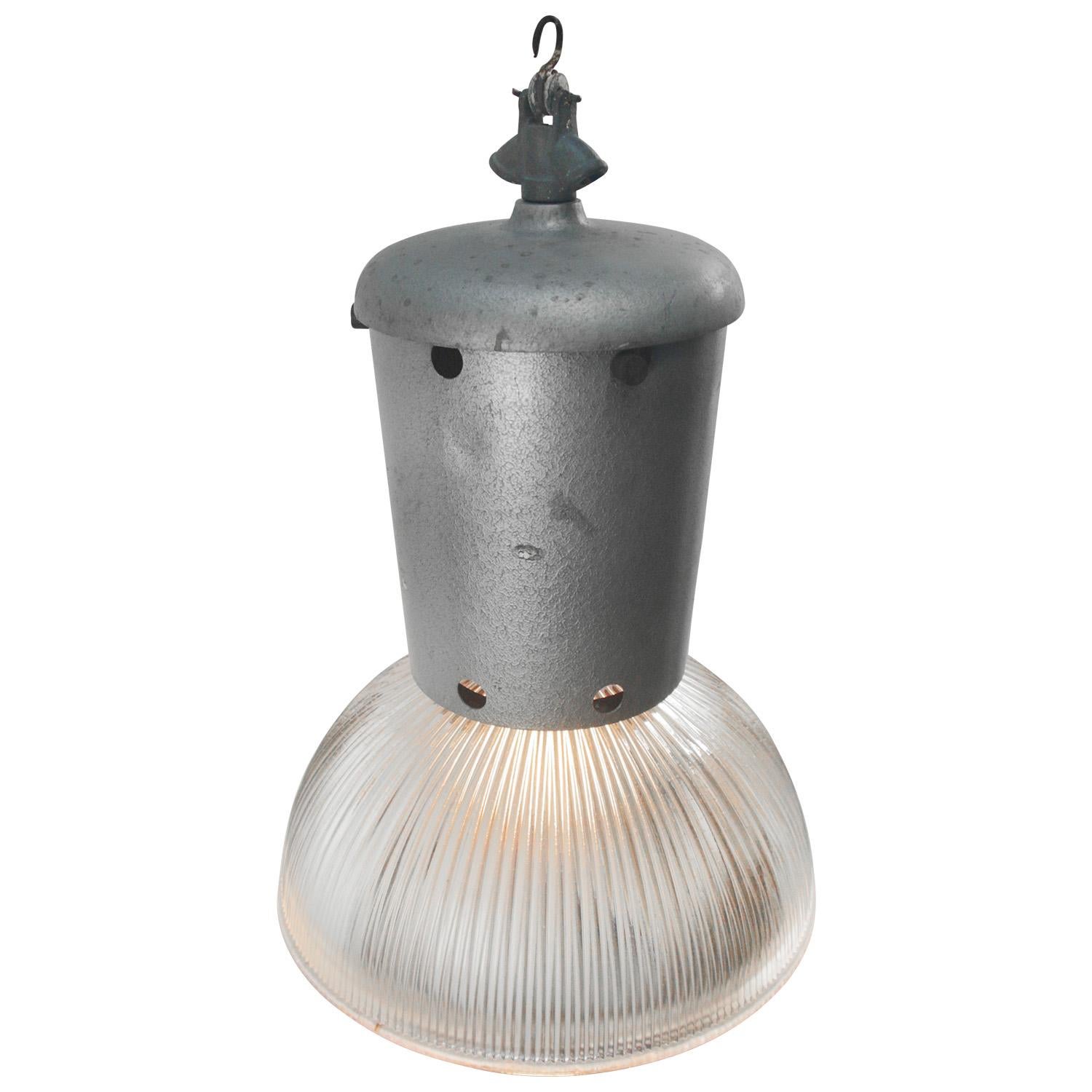 Factory hanging lamp
Grey metal top with clear striped / holophane glass

weight 4.60 kg / 10.1 lb

Priced per individual item. All lamps have been made suitable by international standards for incandescent light bulbs, energy-efficient and LED