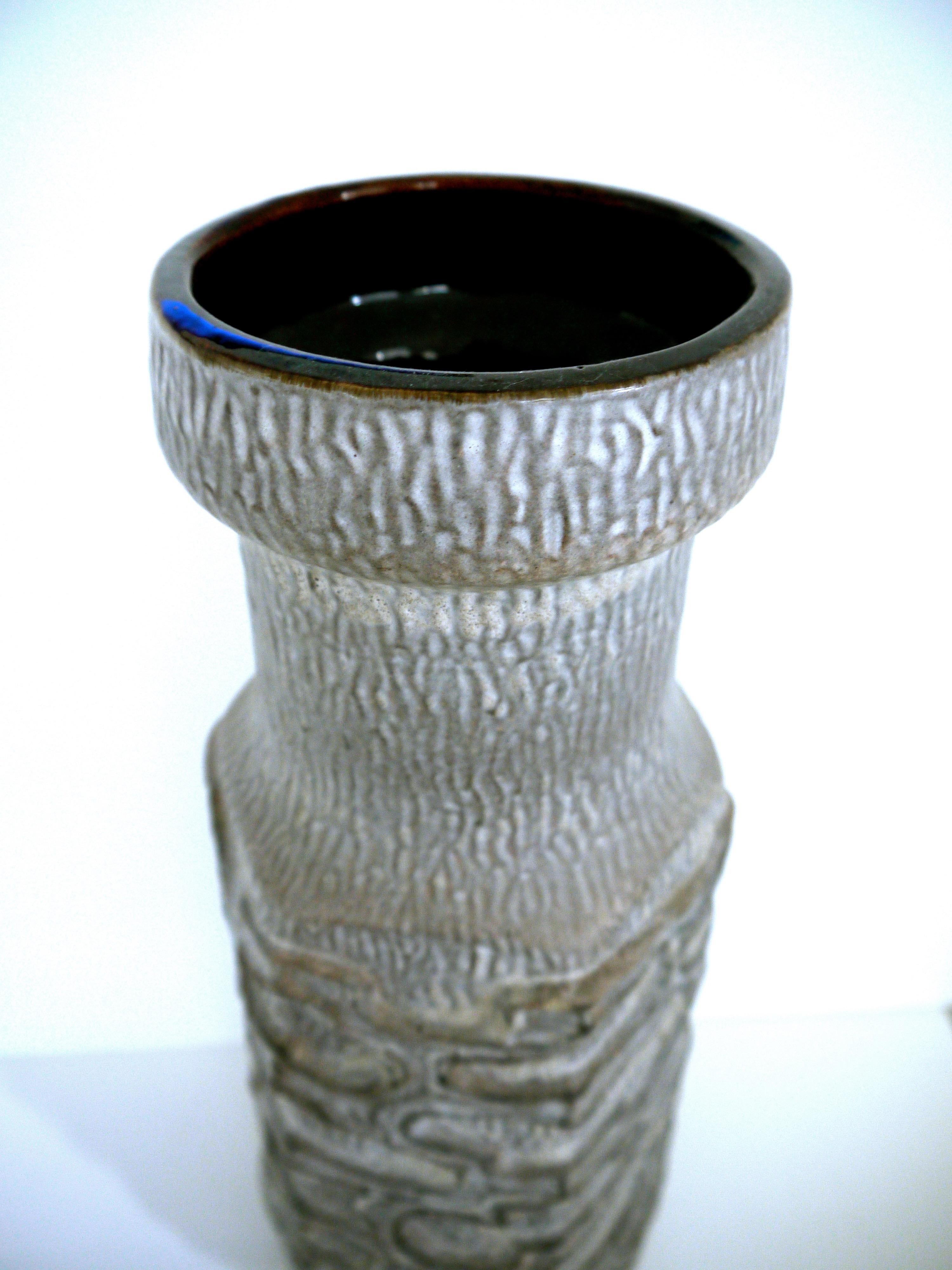 This is an unusual grey floor vase in the Brutalist style. Stamped to base with serial number. Spectacular piece - unique and a great design space.

      