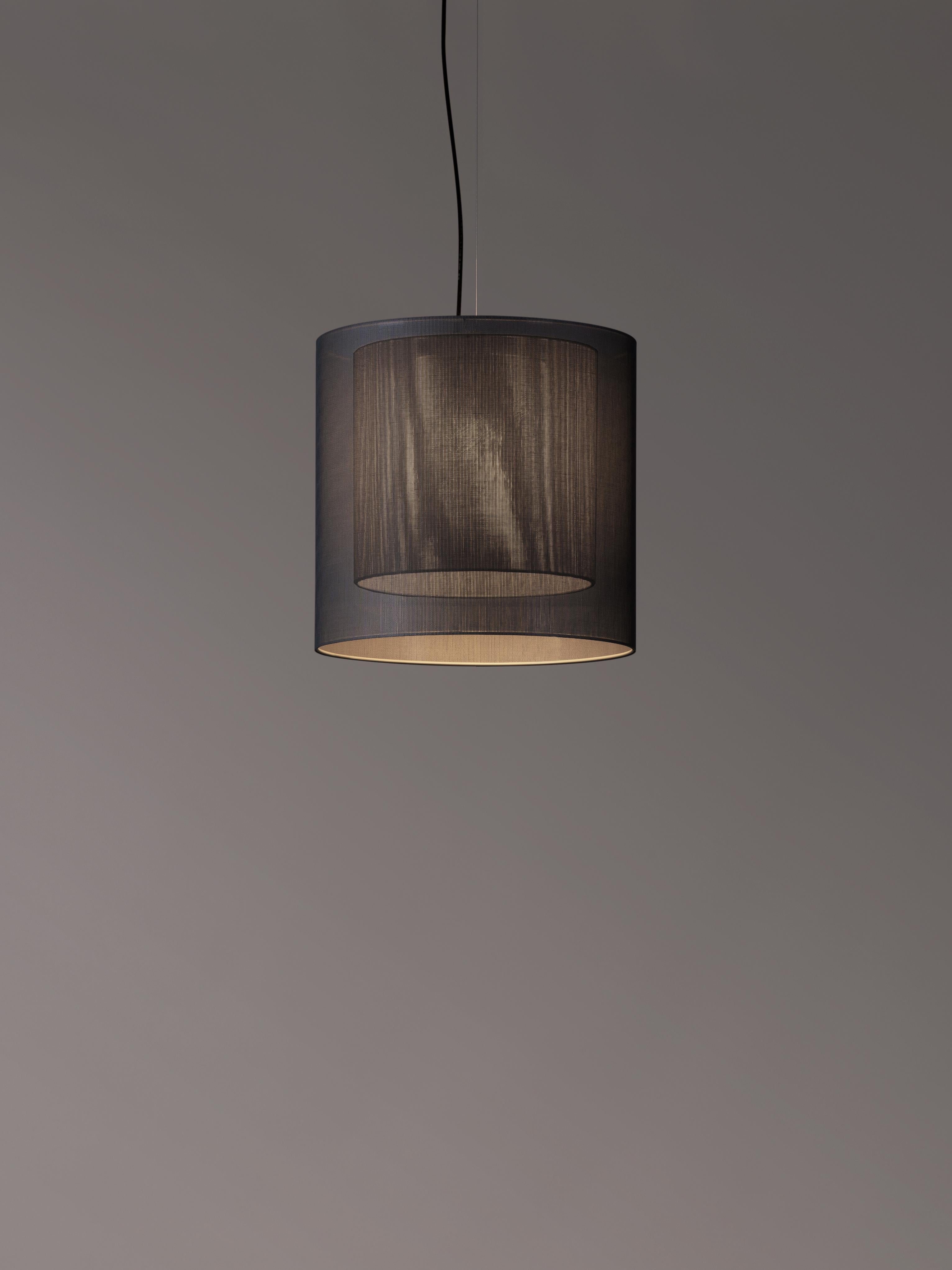 Grey Moaré MS pendant lamp by Antoni Arola
Dimensions: d 46 x h 45 cm
Materials: Metal, polyester.
Available in other colors and sizes.

Moaré’s multiple combinations of formats and colors make it highly versatile. The series takes its name