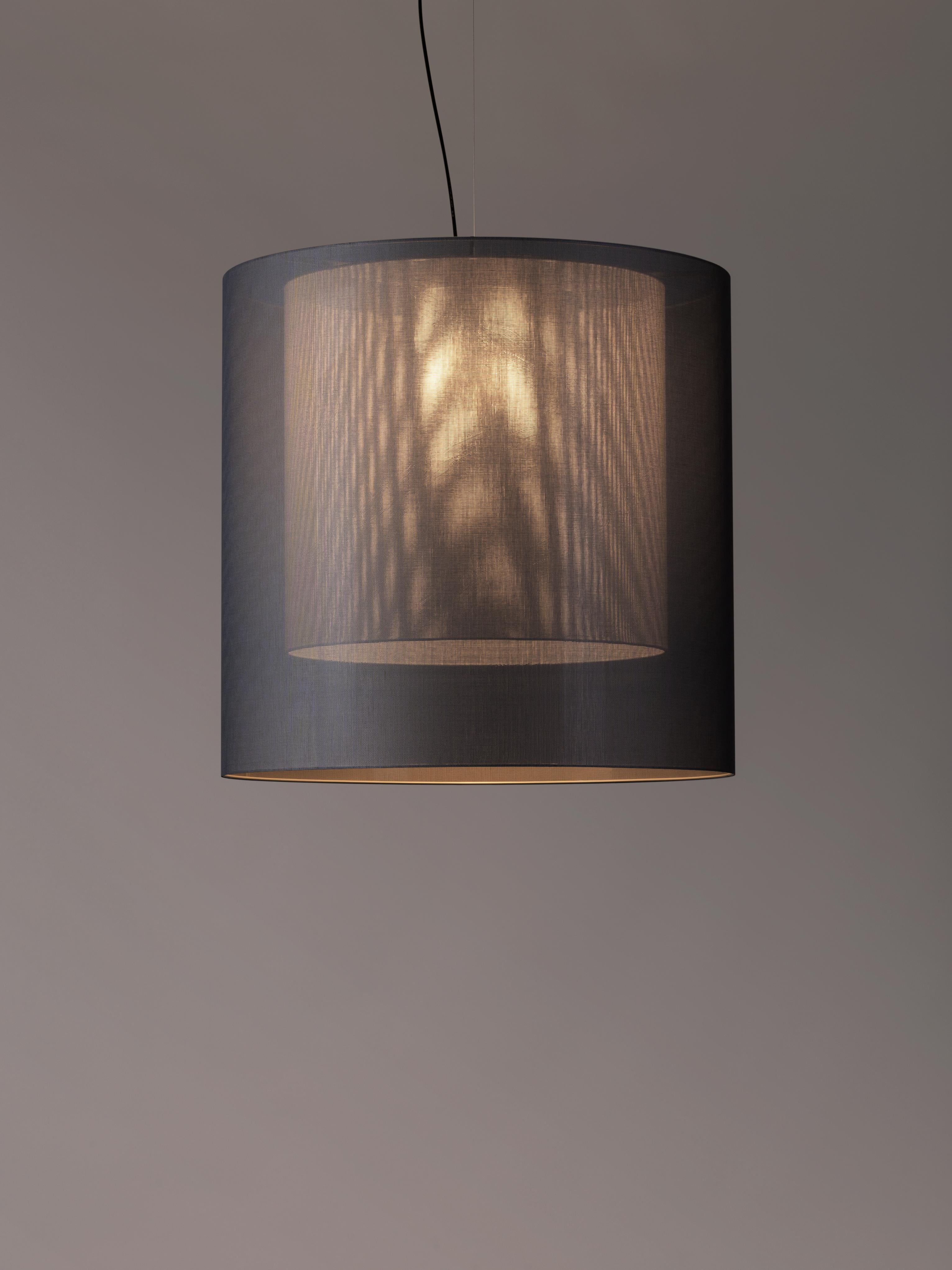 Grey Moaré XL pendant lamp by Antoni Arola
Dimensions: D 83 x H 81 cm
Materials: Metal, polyester.
Available in other colors and sizes.

Moaré’s multiple combinations of formats and colours make it highly versatile. The series takes its name