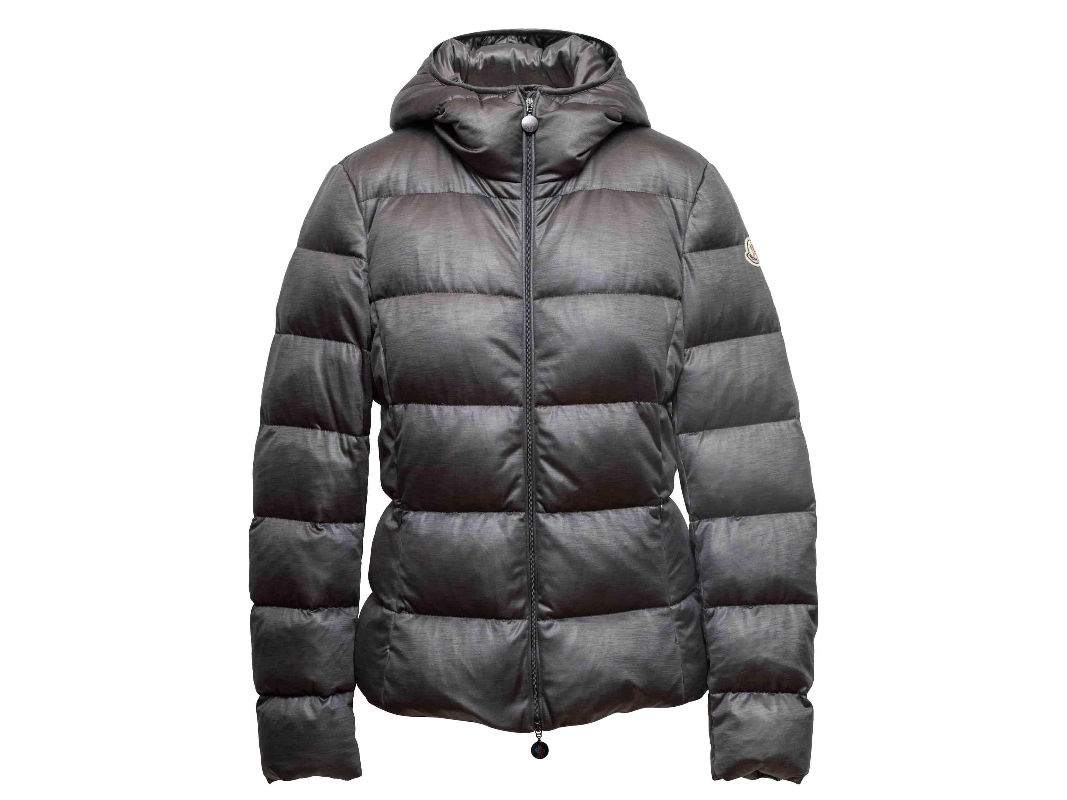 Grey hooded down puffer jacket by Moncler. Dual hip pockets. Front zip closure. 36