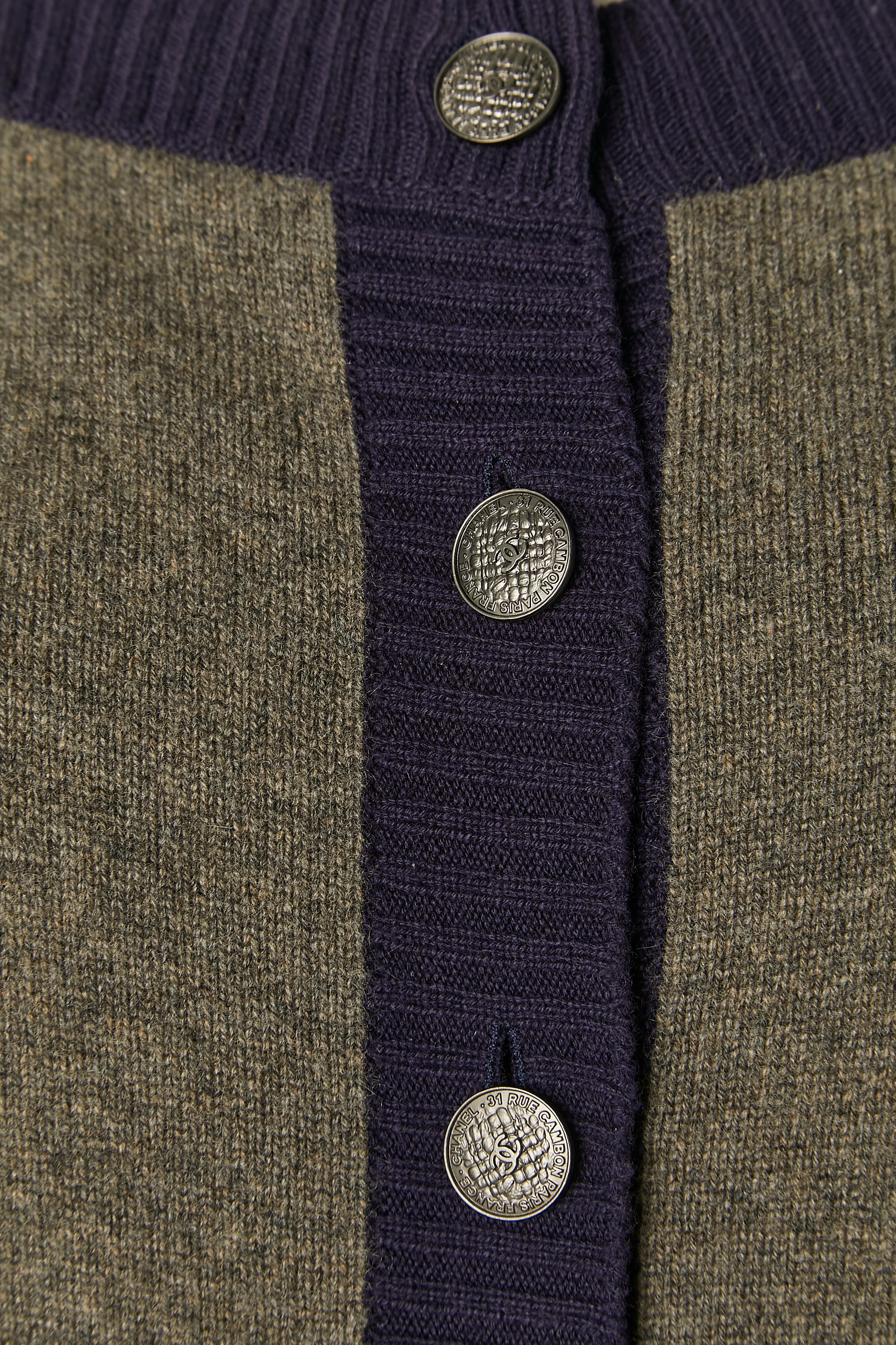 Grey, navy and green cashmere cardigan with branded button. Pocket on both side. 
SIZE M/ L 