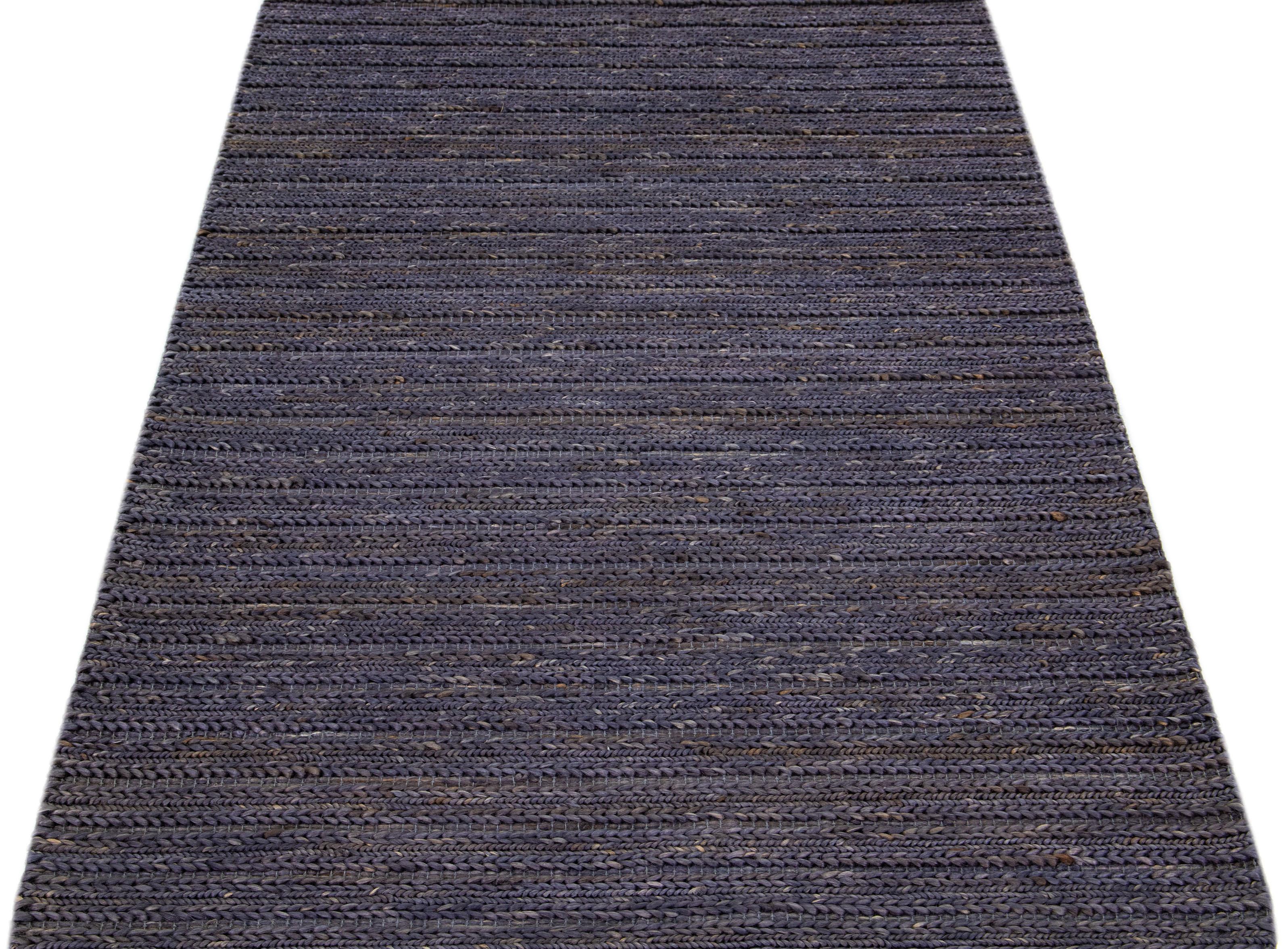 Beautiful natural hand-woven 70% jute and 30% cotton rug with the gray-onyx braided field. This Modern rug is perfect for farmhouse, coastal, rustic, bohemian, or contemporary styles of décor. It has a simple solid design that creates subtle shifts