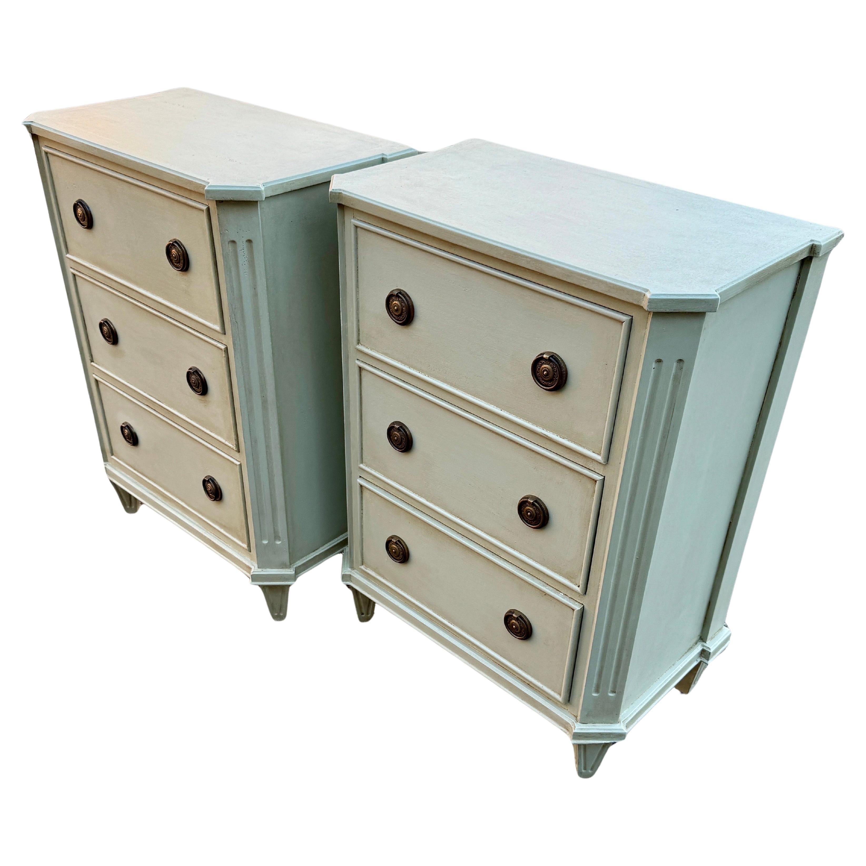 Painted Gustavian Style Chest of Drawers or Side Tables, A Pair 

These classic Swedish style three drawer hand painted chests, small commodes or end tables have been constructed from solid wood with a hand-applied distressed finish and feature