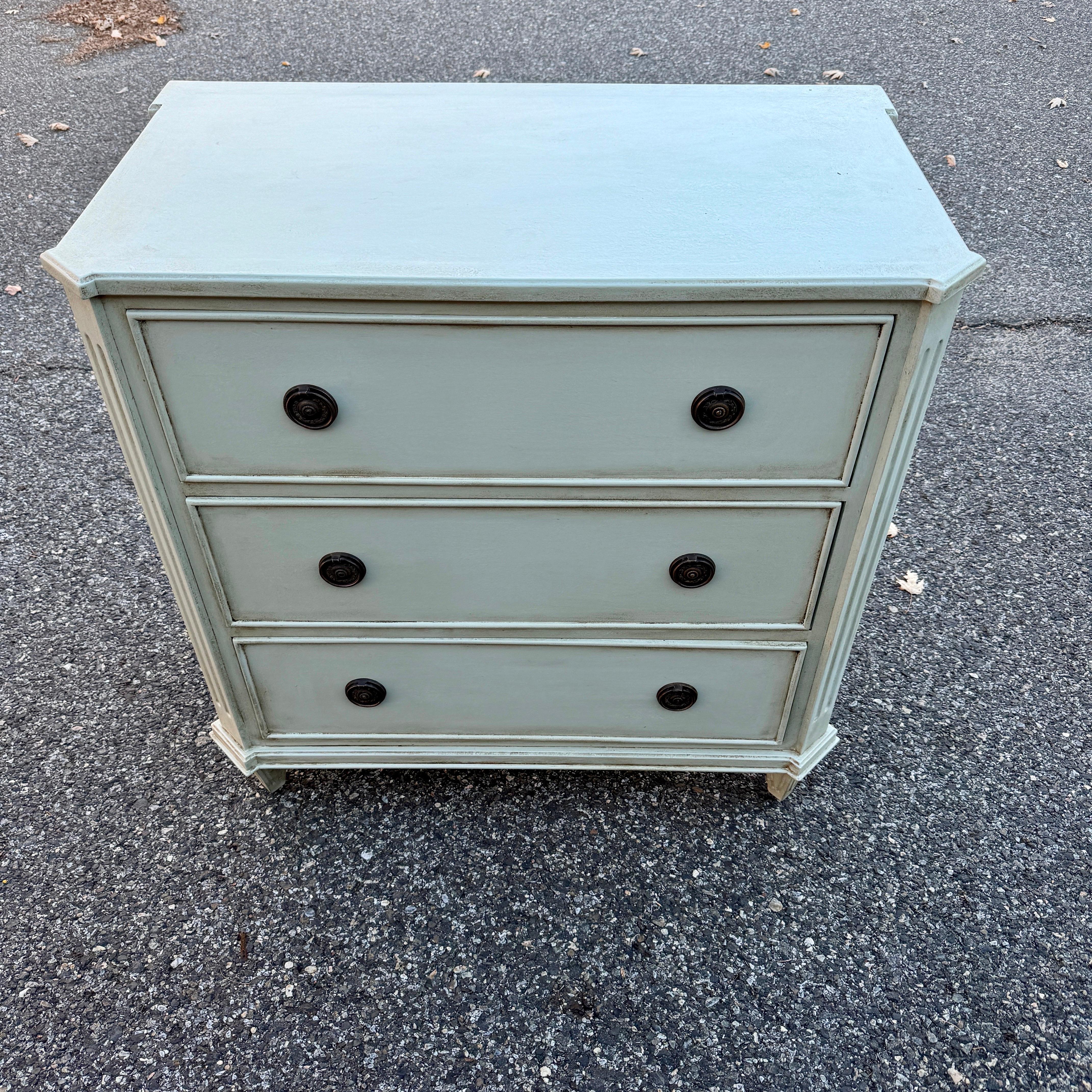 Painted Swedish Gustavian Style 3 Drawer Chest Bureau

Three drawer bureau based on an 18th Century Gustavian antique chest. Handmade and hand painted with solid wood legs and frame. Great detailing including brass hardware pulls. This piece is very
