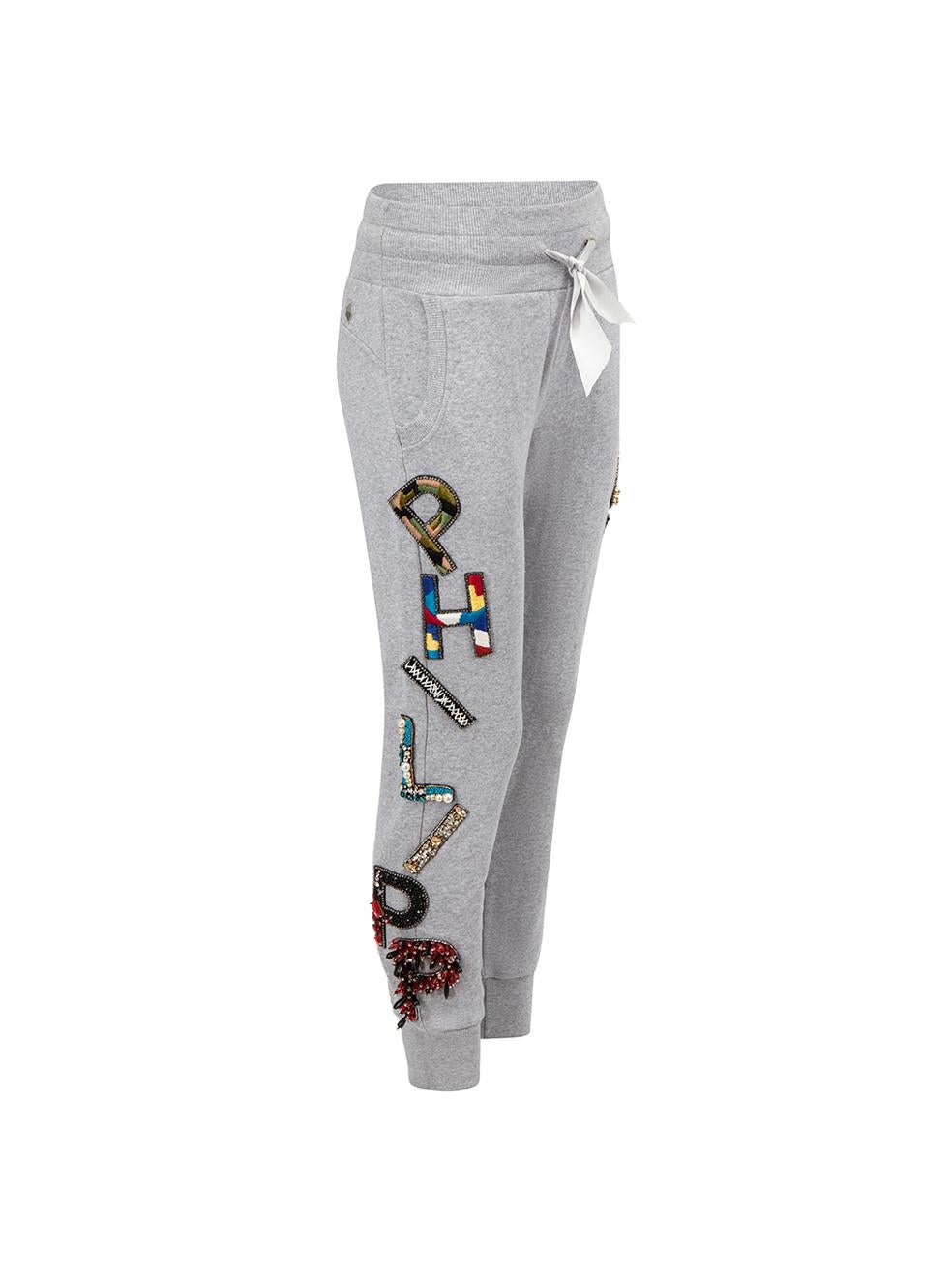 CONDITION is Very good. Minimal wear to trousers is evident. Minor loose threads to patches on this used Philipp Plein designer resale item.



Details


Limited edition

Grey

Cotton

Joggers

Multicoloured 'Philipp Plein 87' patches

Elasticated